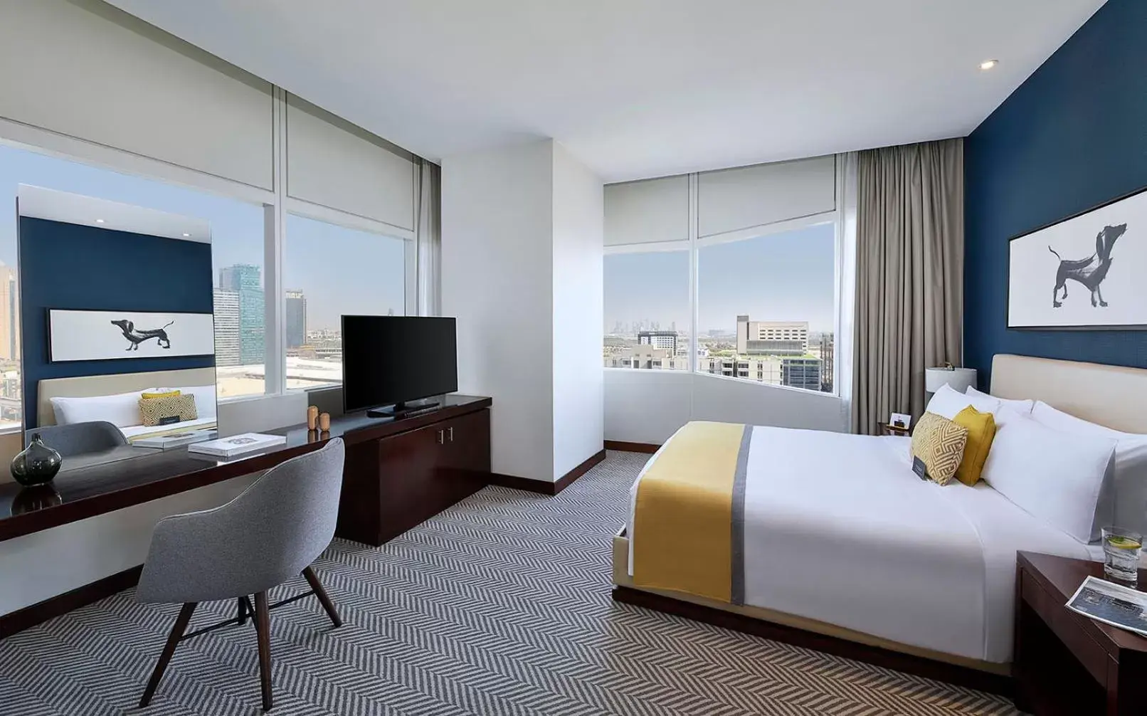Bed, TV/Entertainment Center in voco Dubai, an IHG Hotel