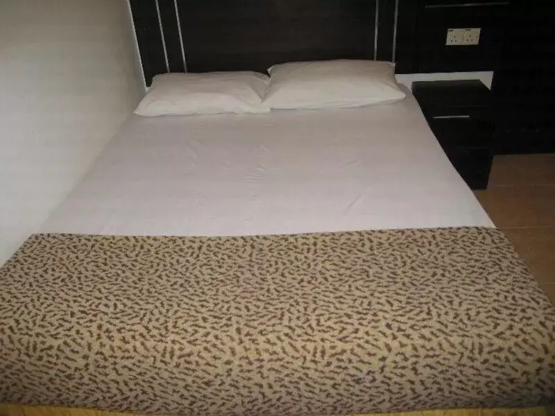 Bed in Rainbow Hotel