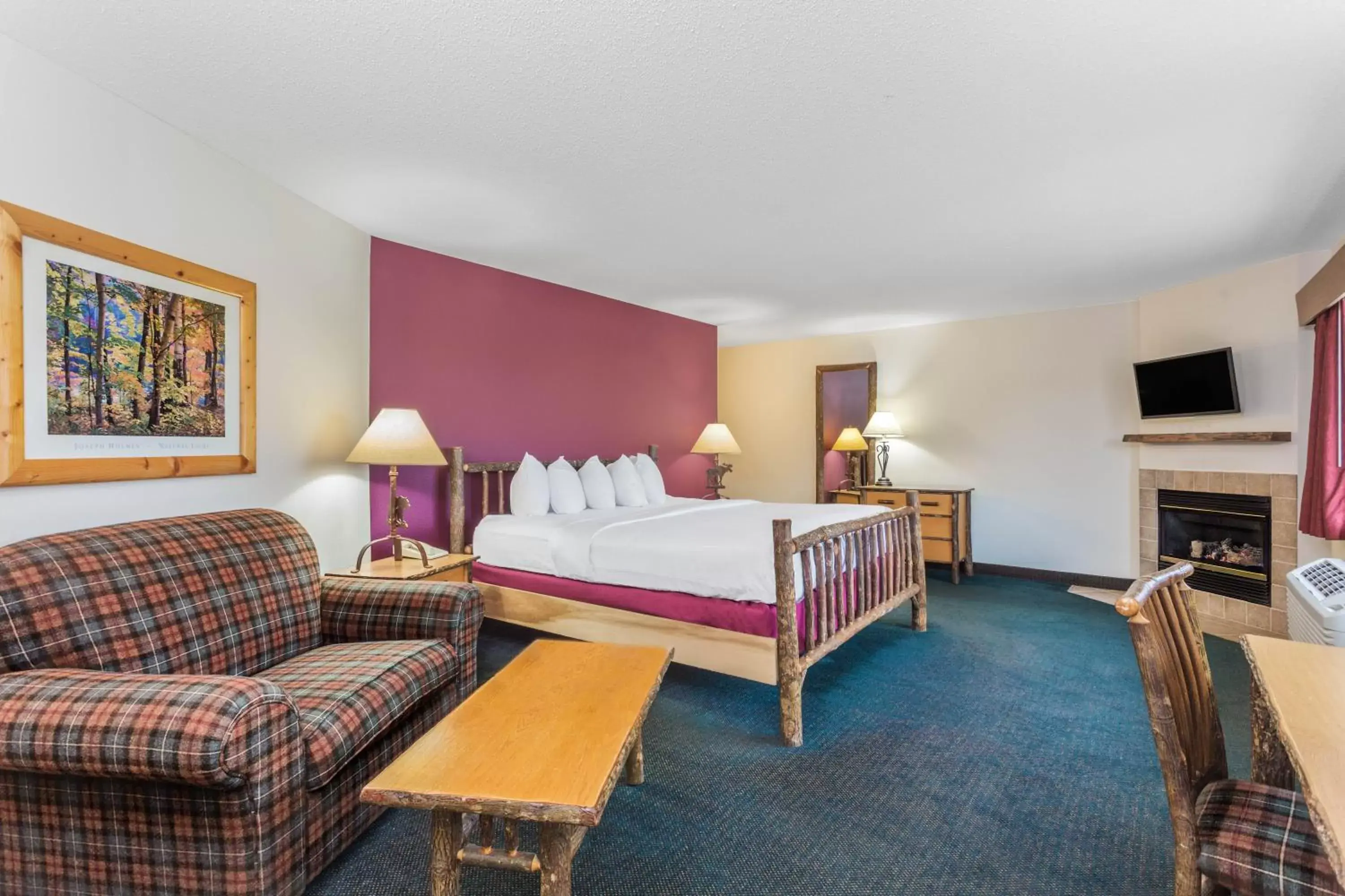 Bedroom in AmericInn by Wyndham Wisconsin Dells