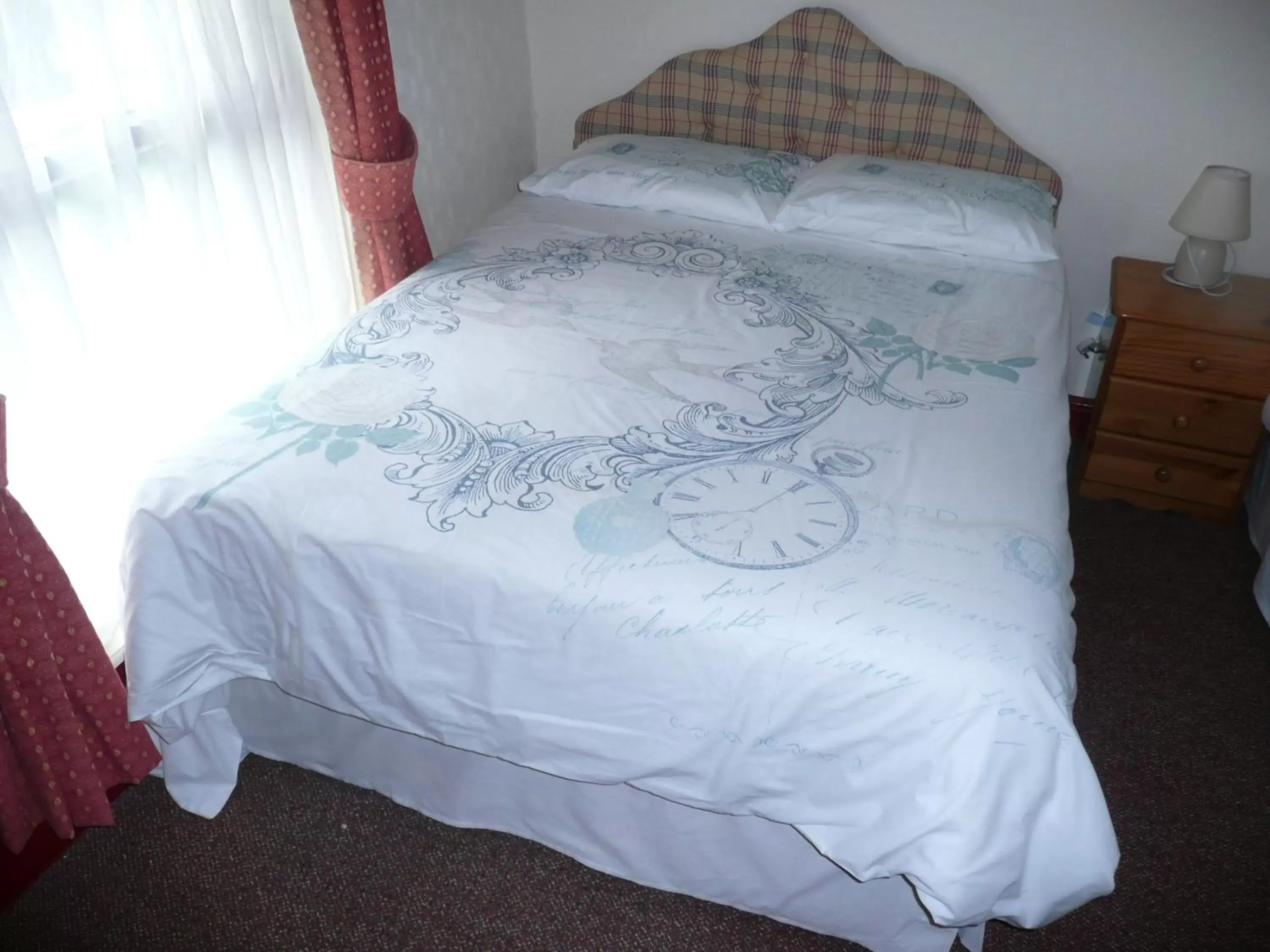 Bed in Beijing Dragon Hotel