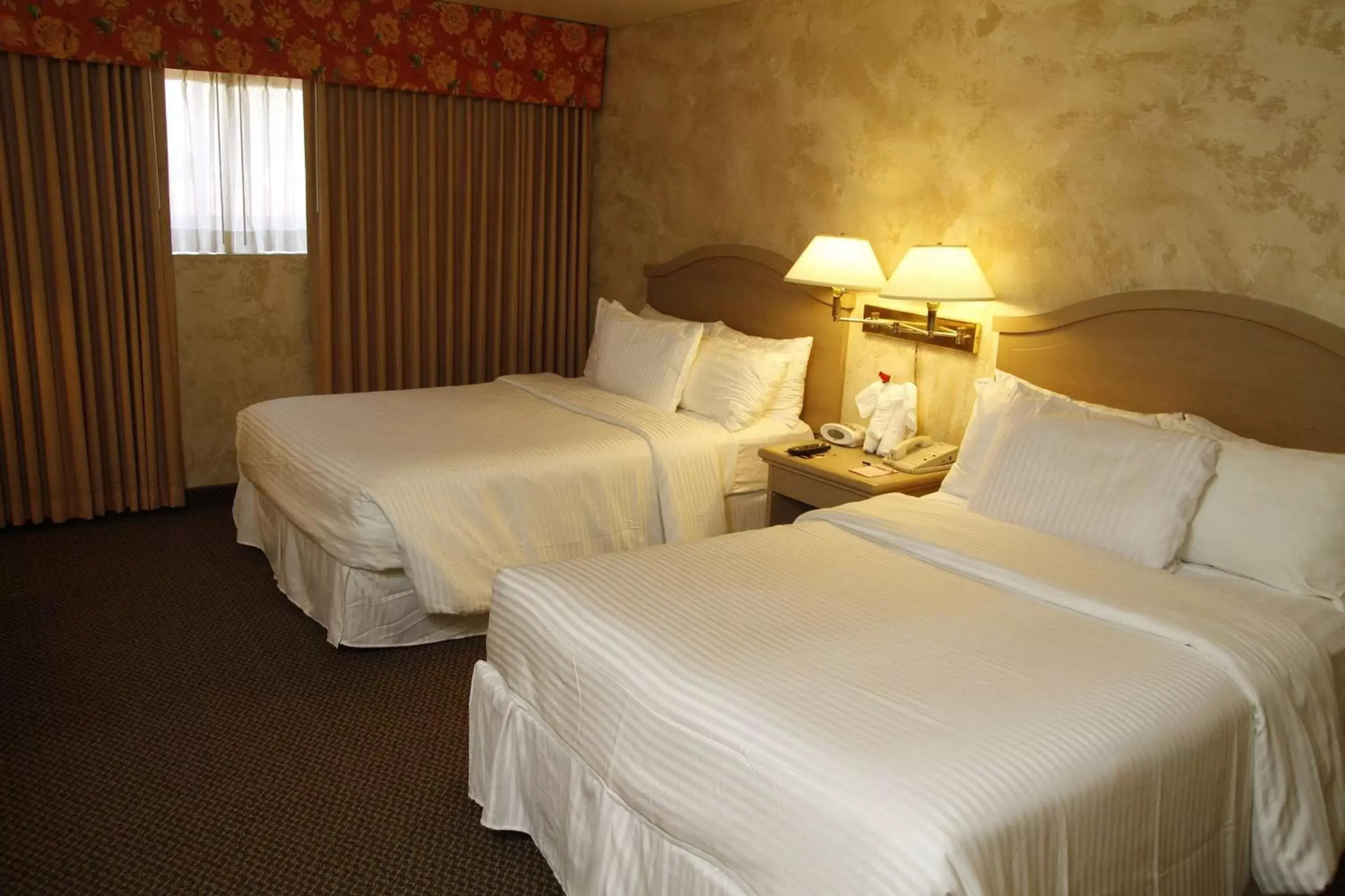 Photo of the whole room, Bed in Ramada by Wyndham Viscount Suites Tucson East