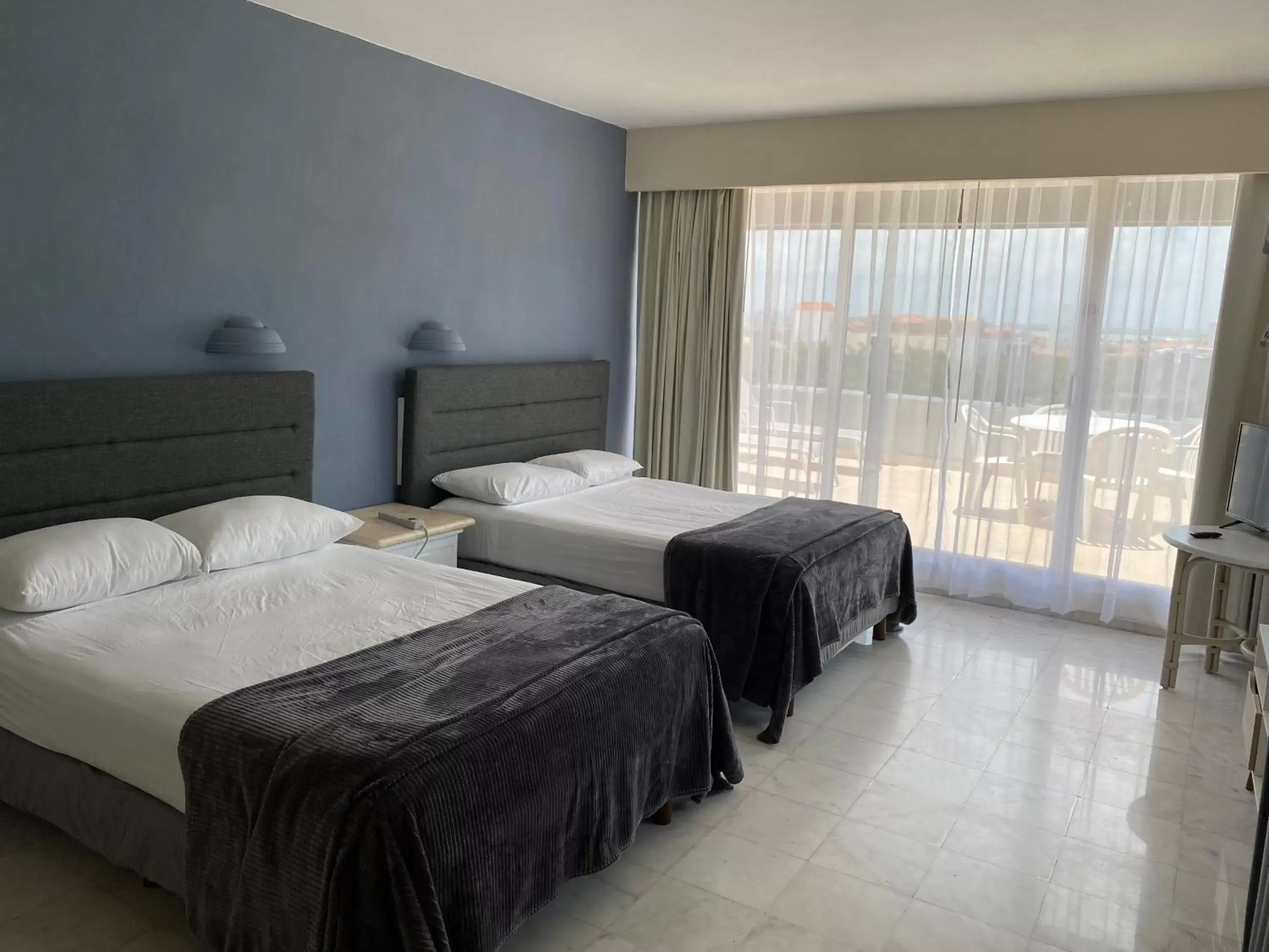 Bedroom, Bed in Condos inside an Ocean Front Hotel Resort