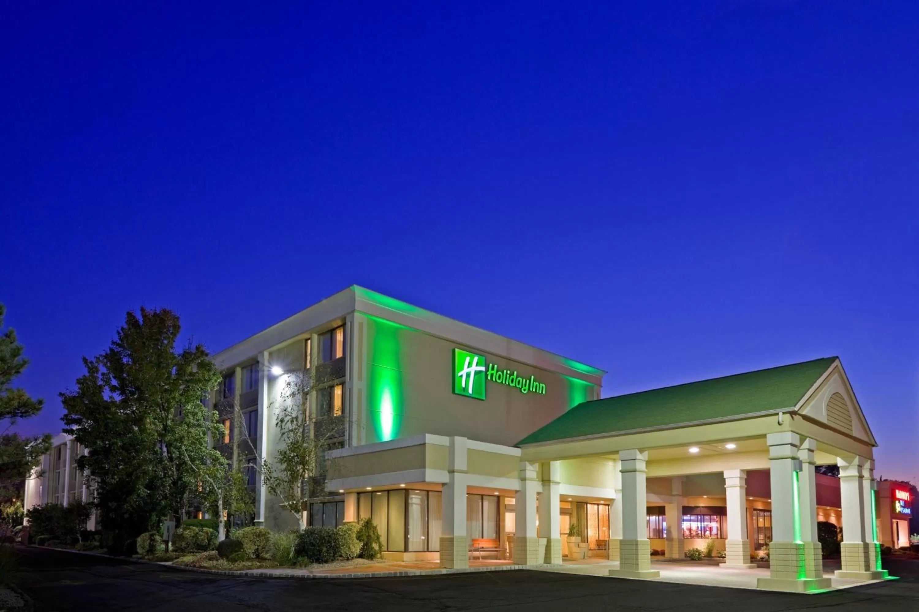 Property building in Holiday Inn & Suites Parsippany Fairfield by IHG
