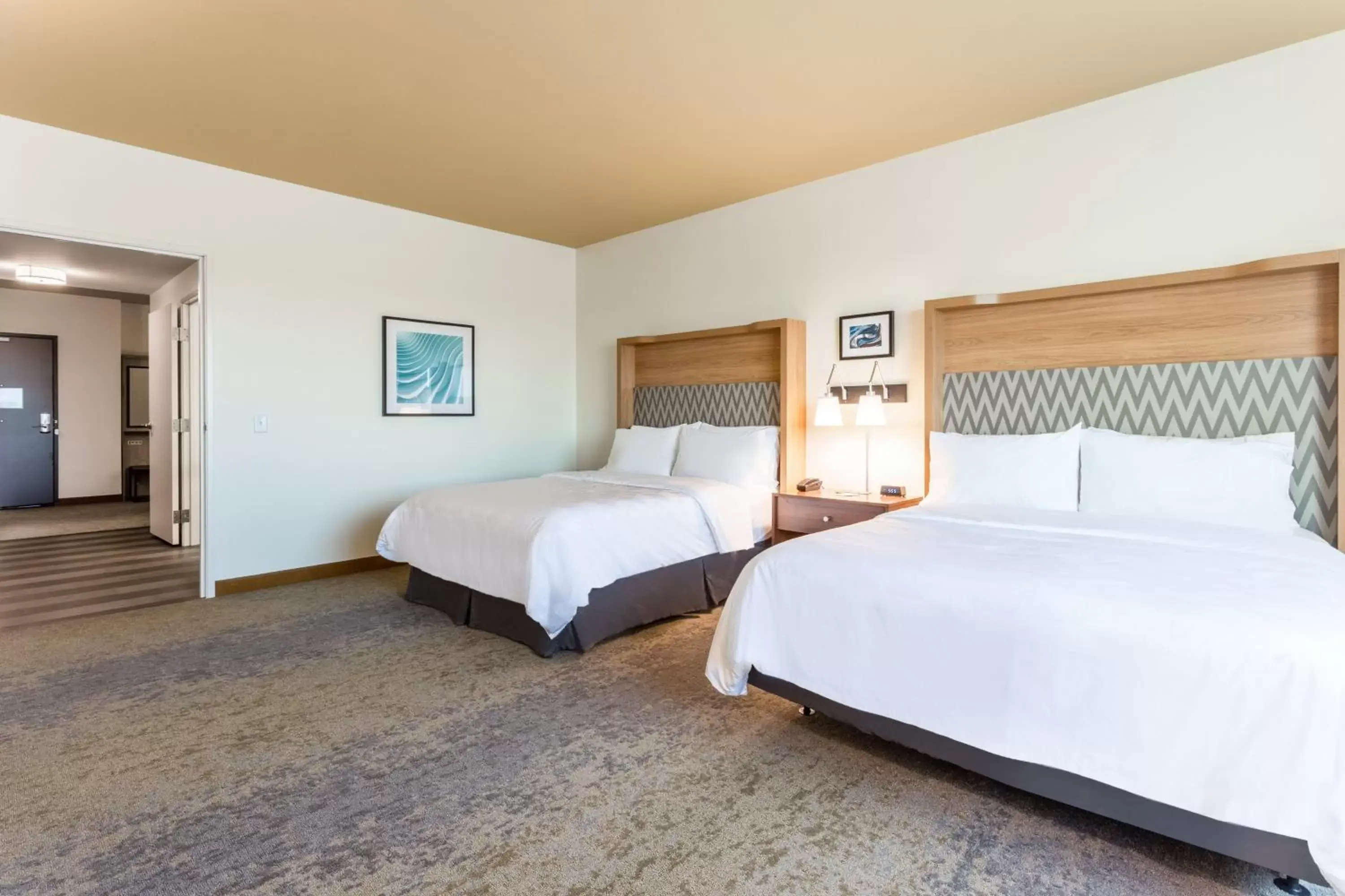 Bedroom, Bed in Holiday Inn & Suites Cedar Falls-Waterloo Event Ctr, an IHG Hotel