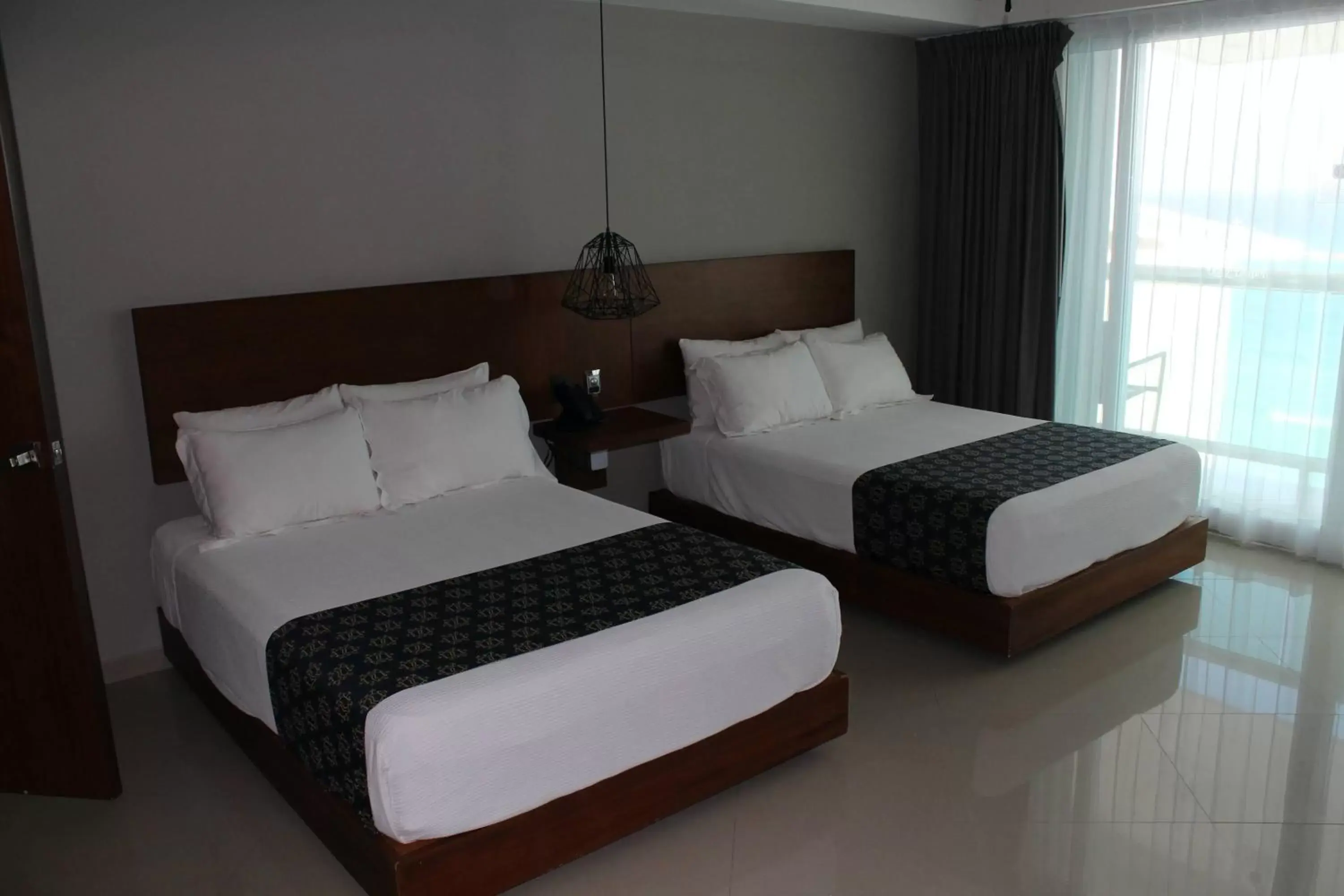 Bed in Ocean Dream Cancun by GuruHotel