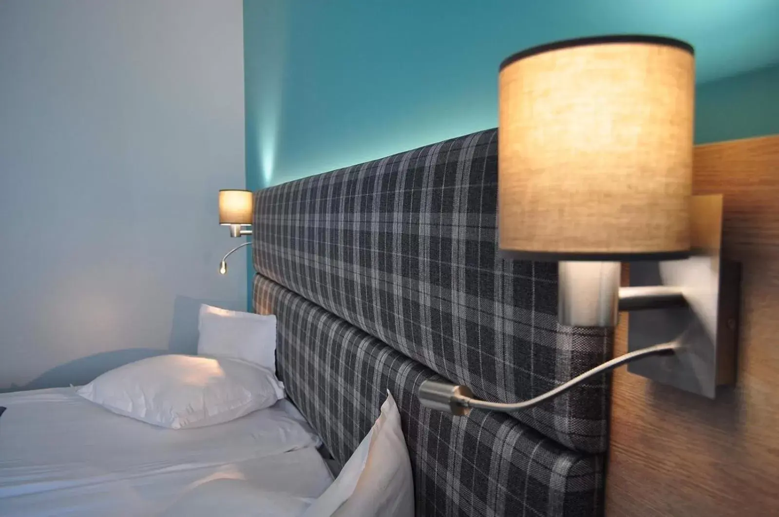 Bed in Aqua Hotel