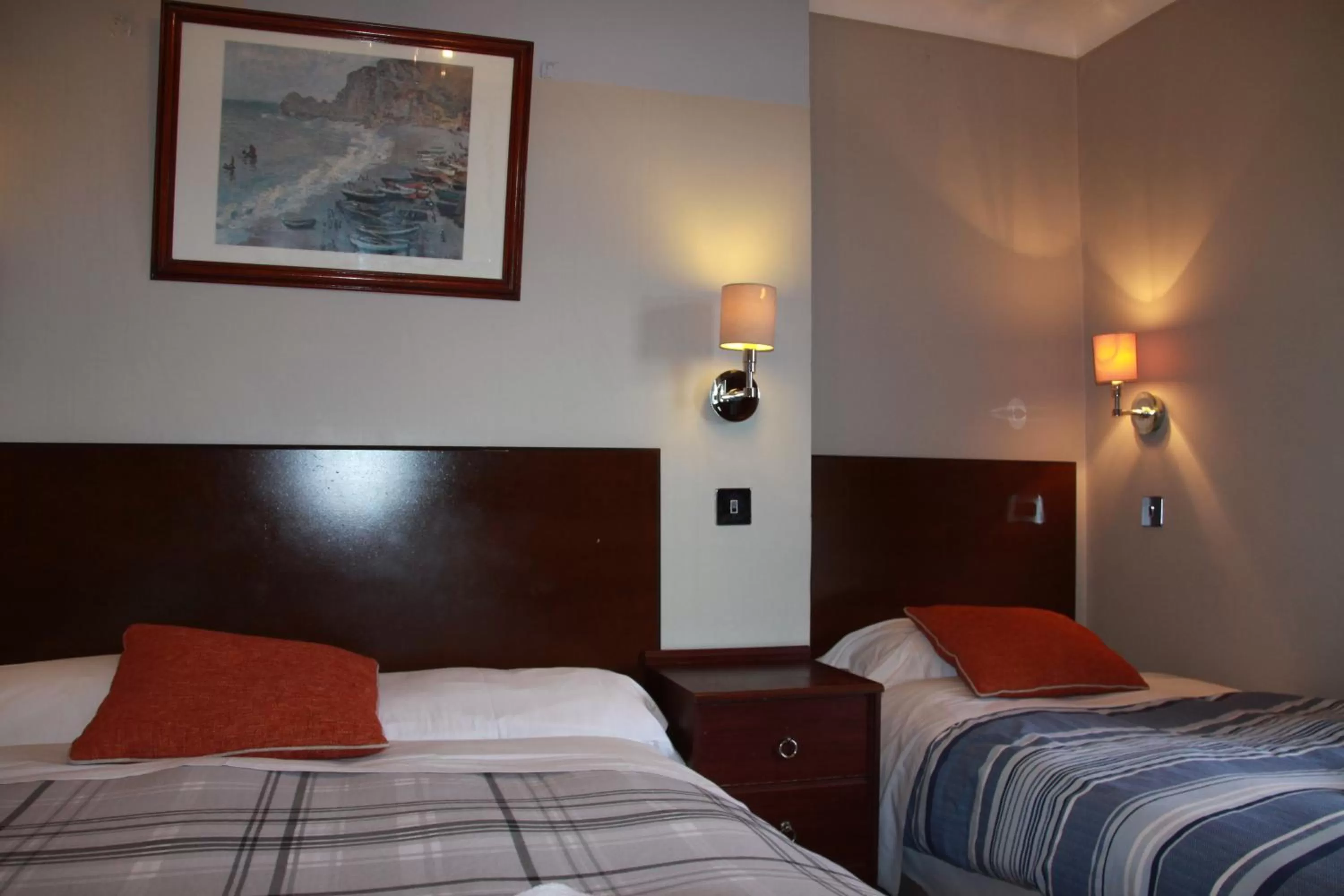 Bed in Ambassador Hotel