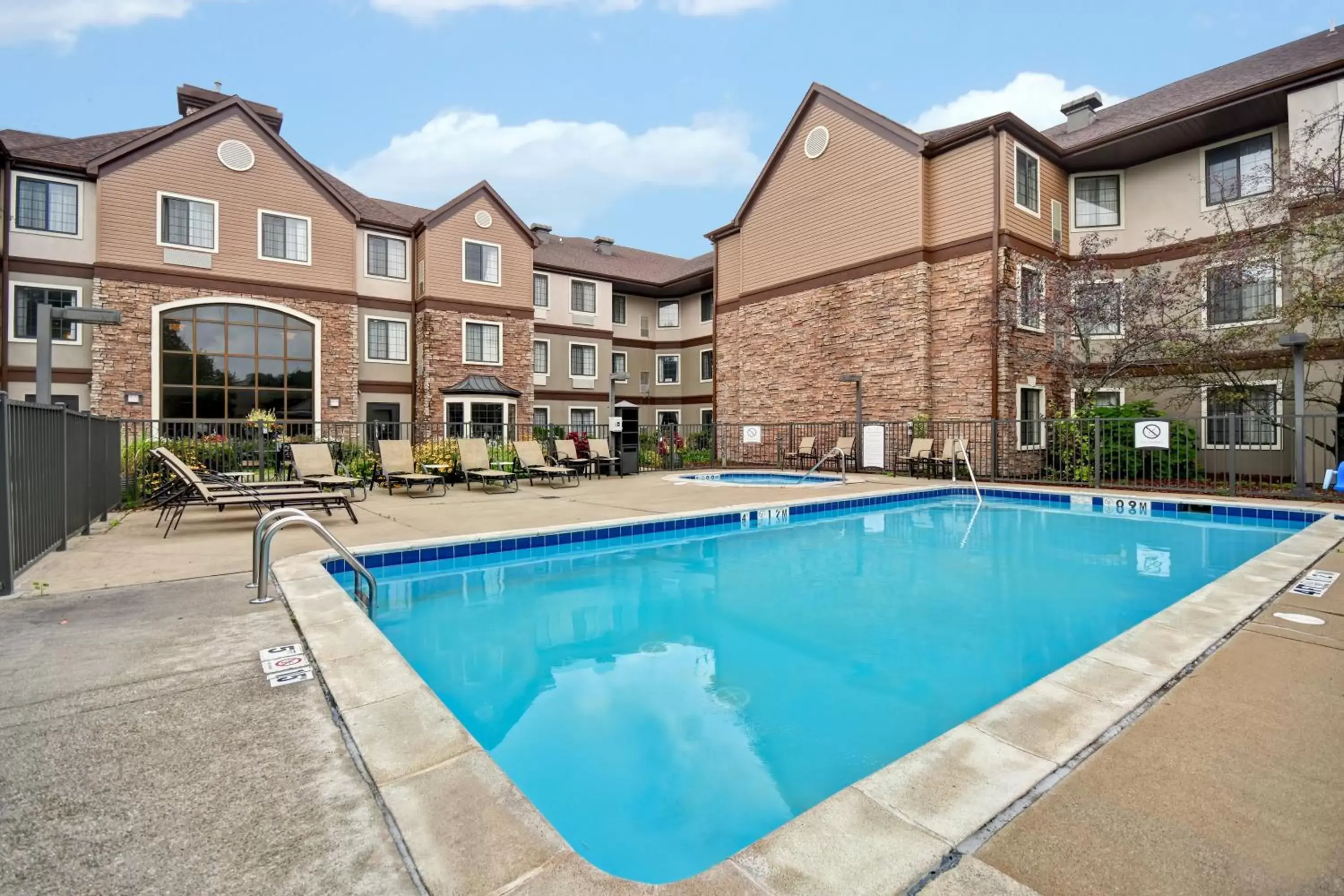 Swimming pool, Property Building in Staybridge Suites Grand Rapids-Kentwood, an IHG Hotel