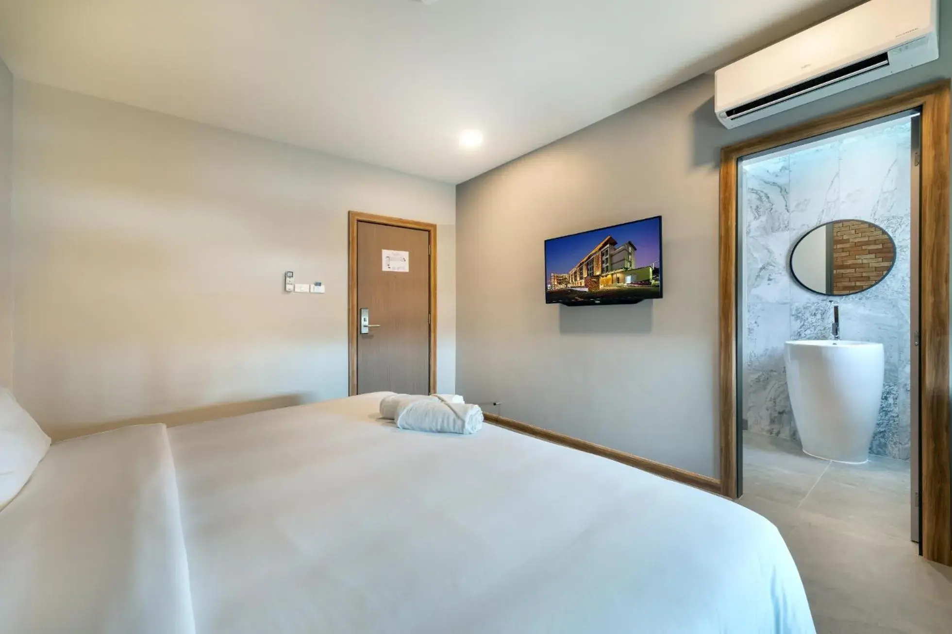 Bed in PLAAI Plus Hotel Rayong