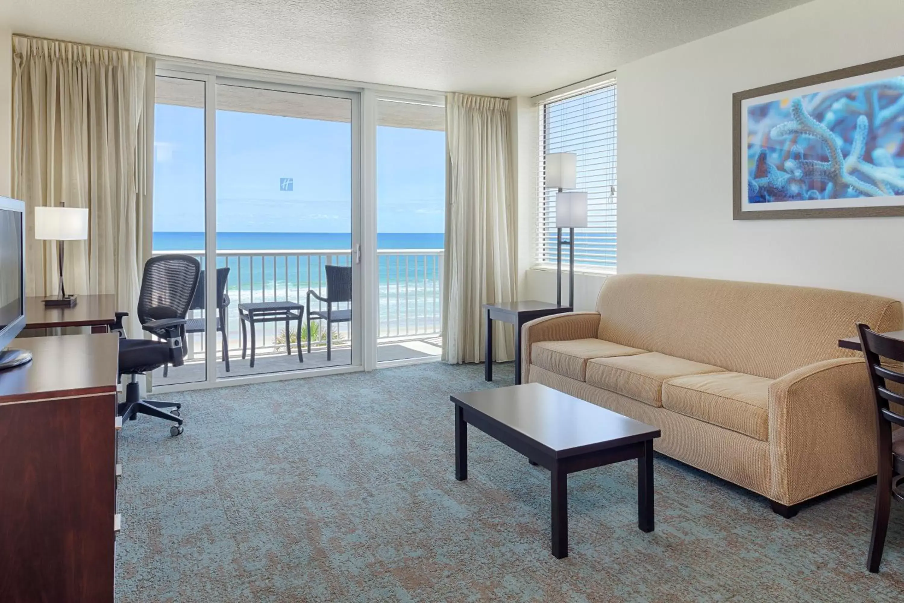 Photo of the whole room, Seating Area in Holiday Inn Resort Daytona Beach Oceanfront, an IHG Hotel