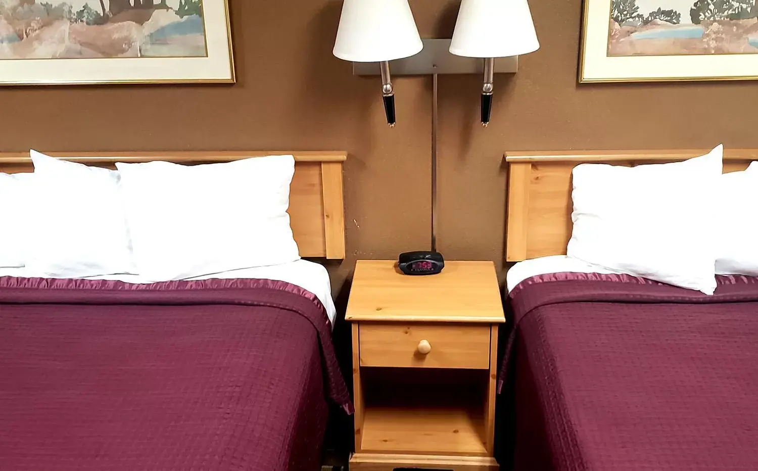 Bed in Coratel Inn & Suites by Jasper Mankato