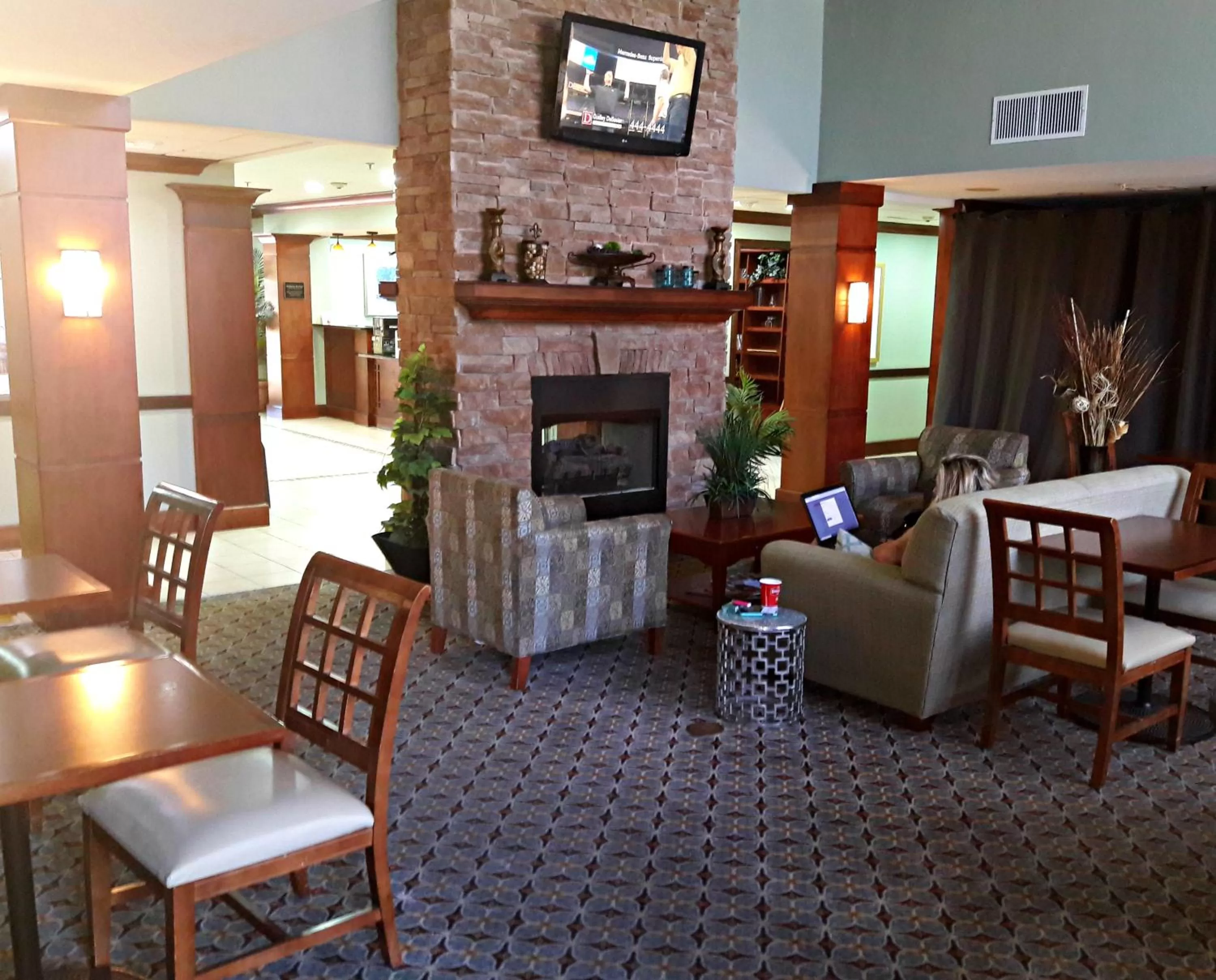 Communal lounge/ TV room in WeStay Suites - Covington/Mandeville