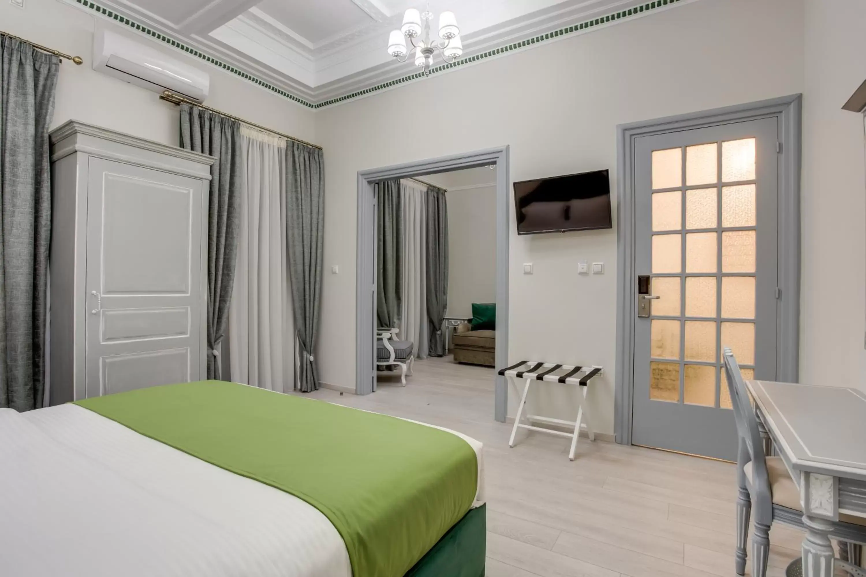 Bedroom, TV/Entertainment Center in Pandrosos Divine Suites
