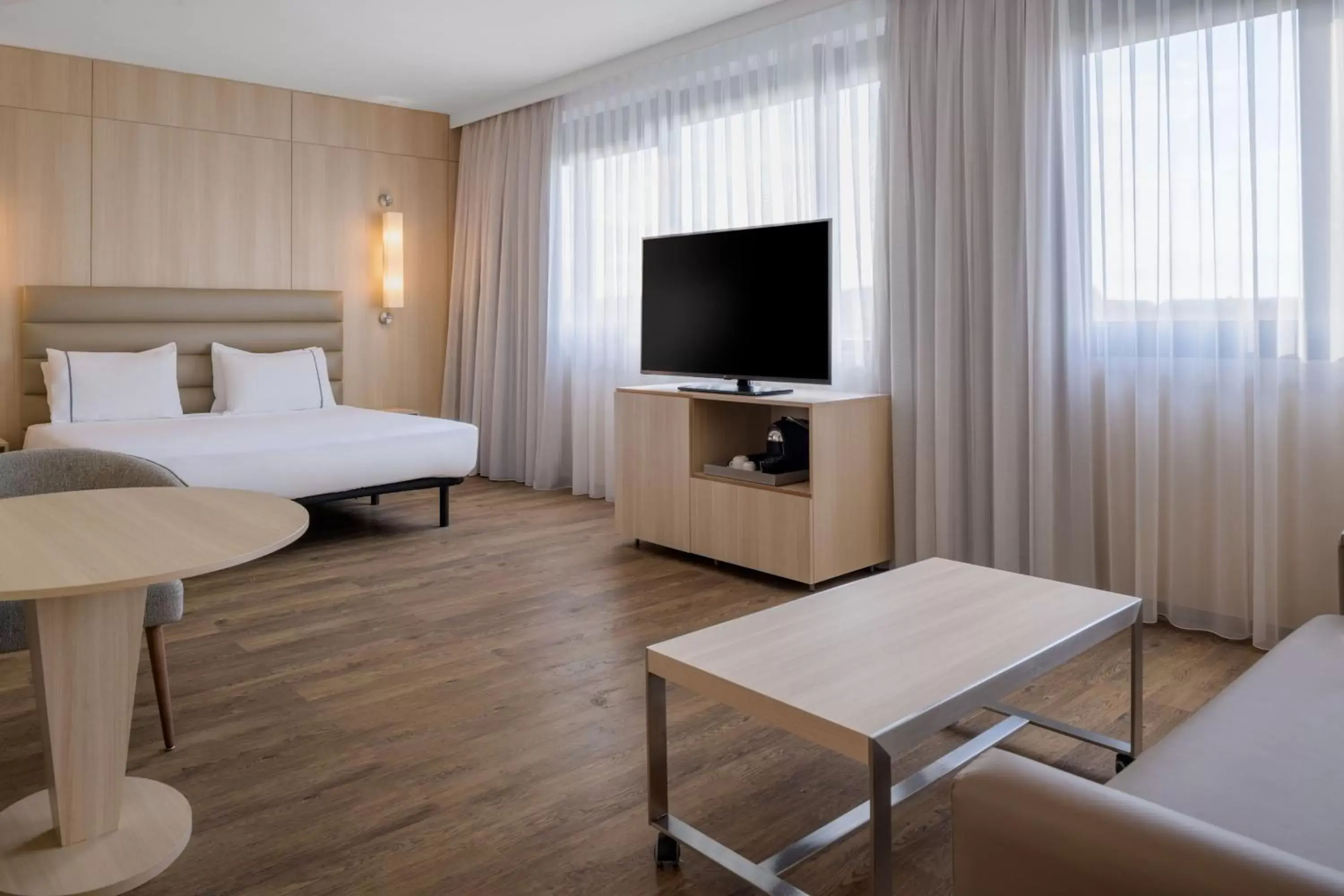 Photo of the whole room, TV/Entertainment Center in AC Hotel by Marriott Pisa