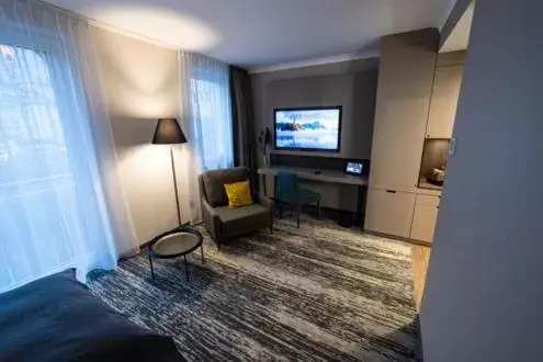 Seating area, TV/Entertainment Center in Kranz Parkhotel