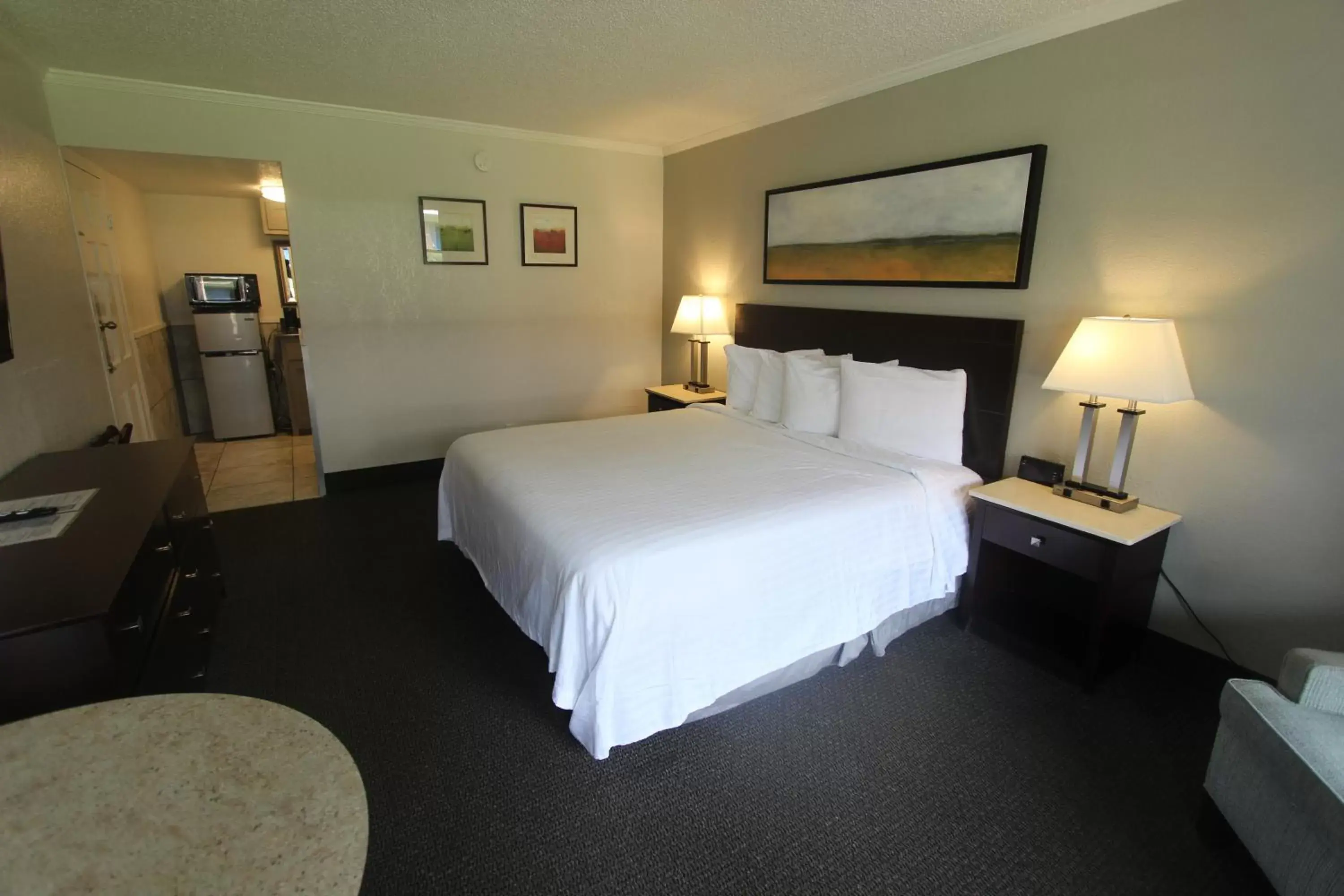 Bed in At Home Inn & Suites