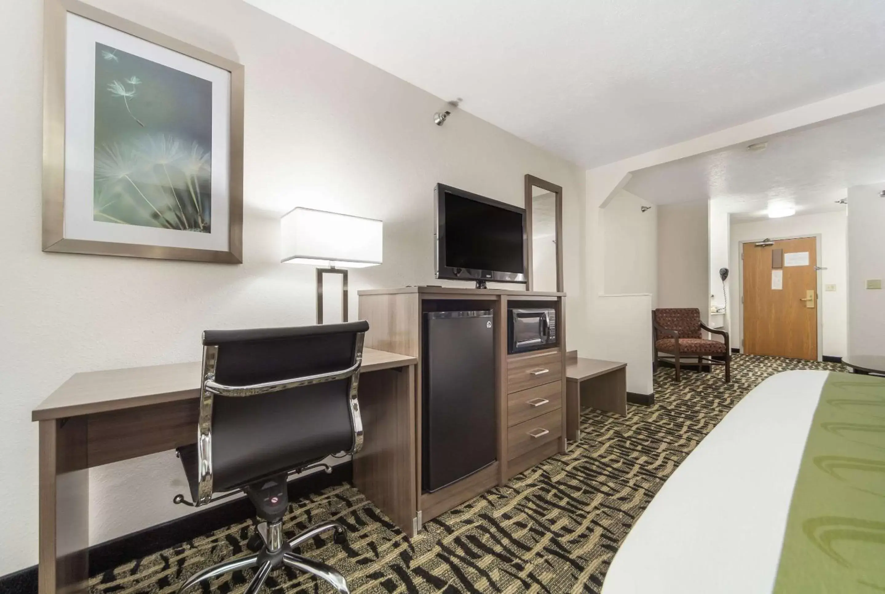 Photo of the whole room, TV/Entertainment Center in Quality Inn & Suites West Omaha - NE Linclon