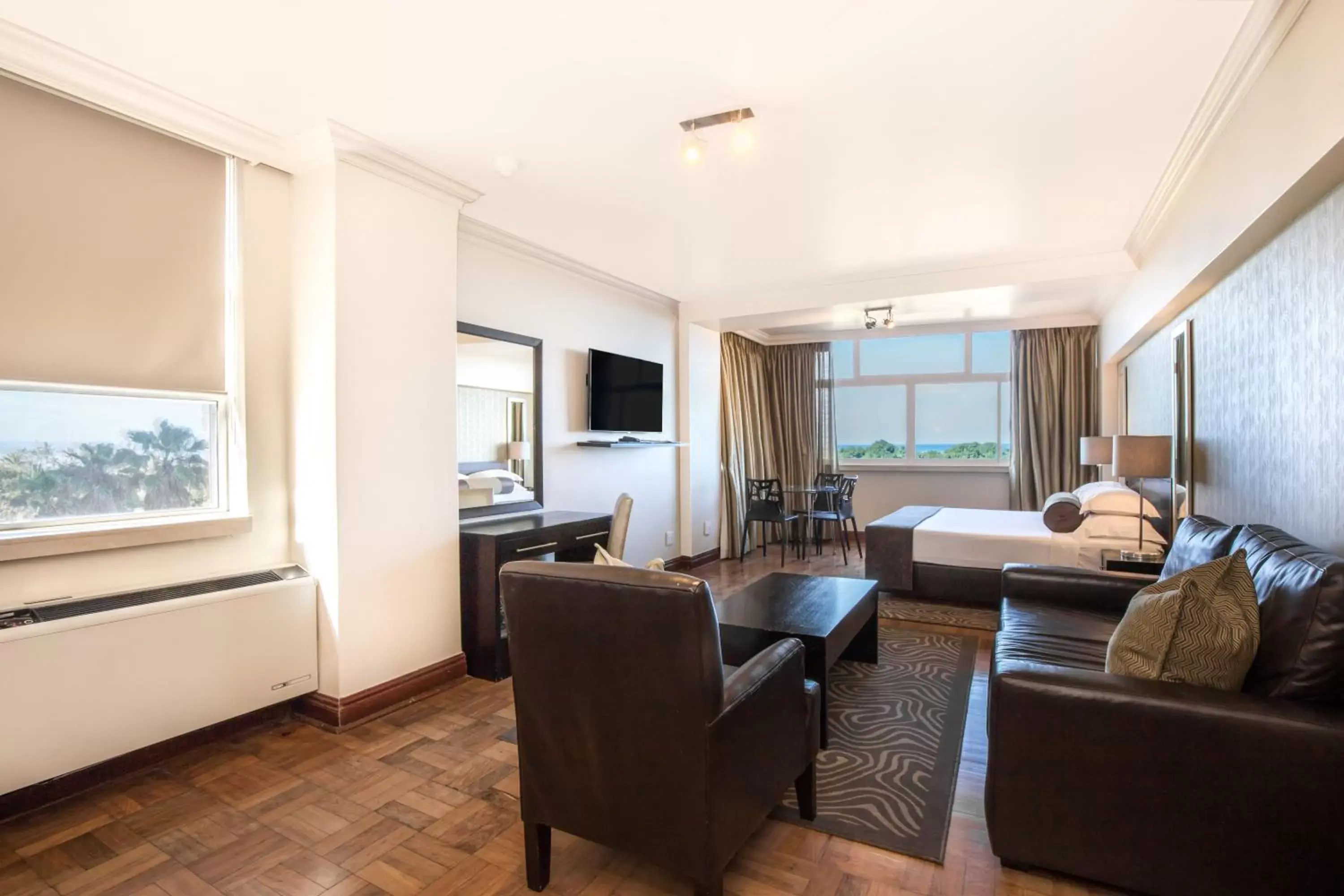 Bedroom, Seating Area in Belaire Suites Hotel