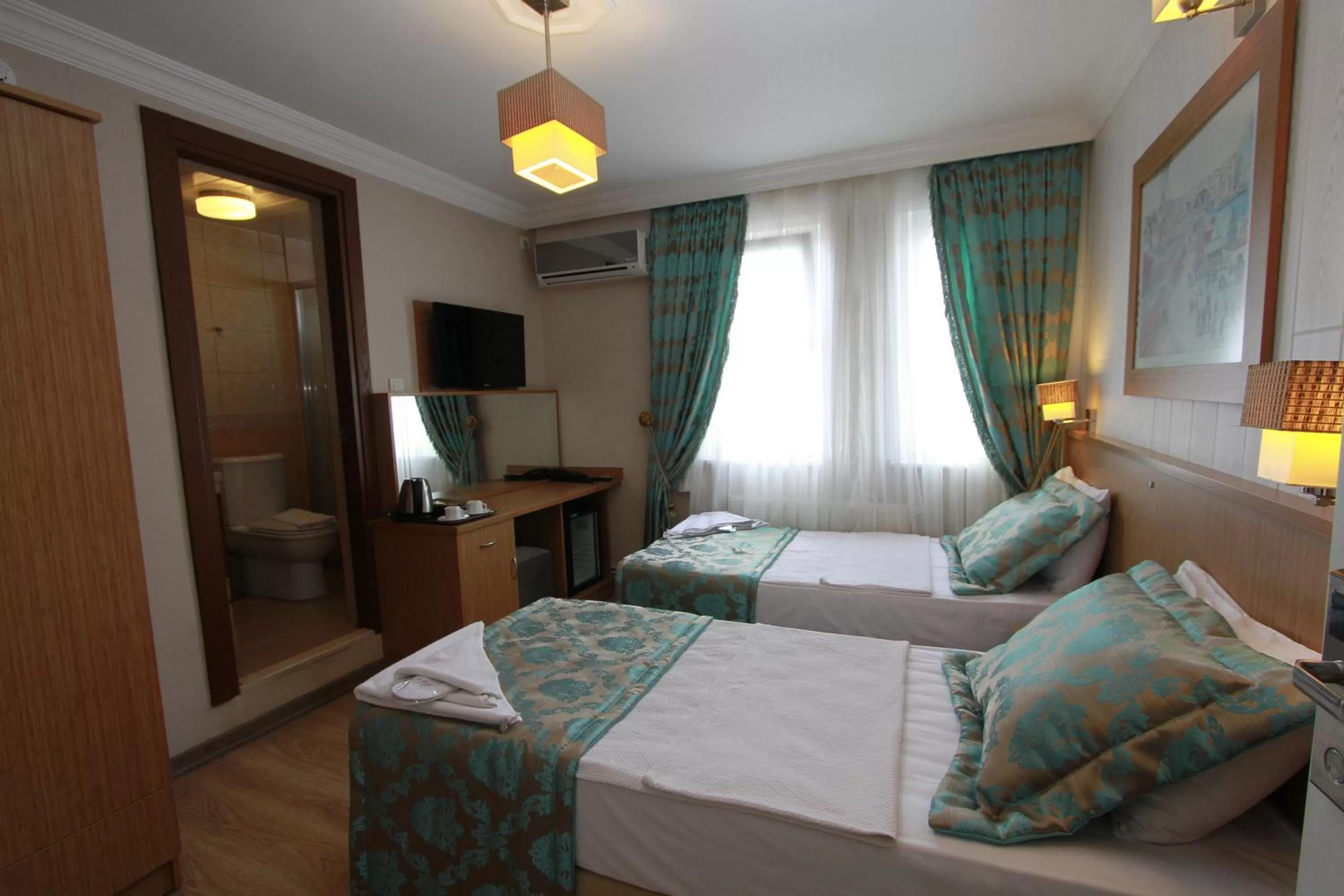 Bed in Agora Boutique Hotel & Bistro