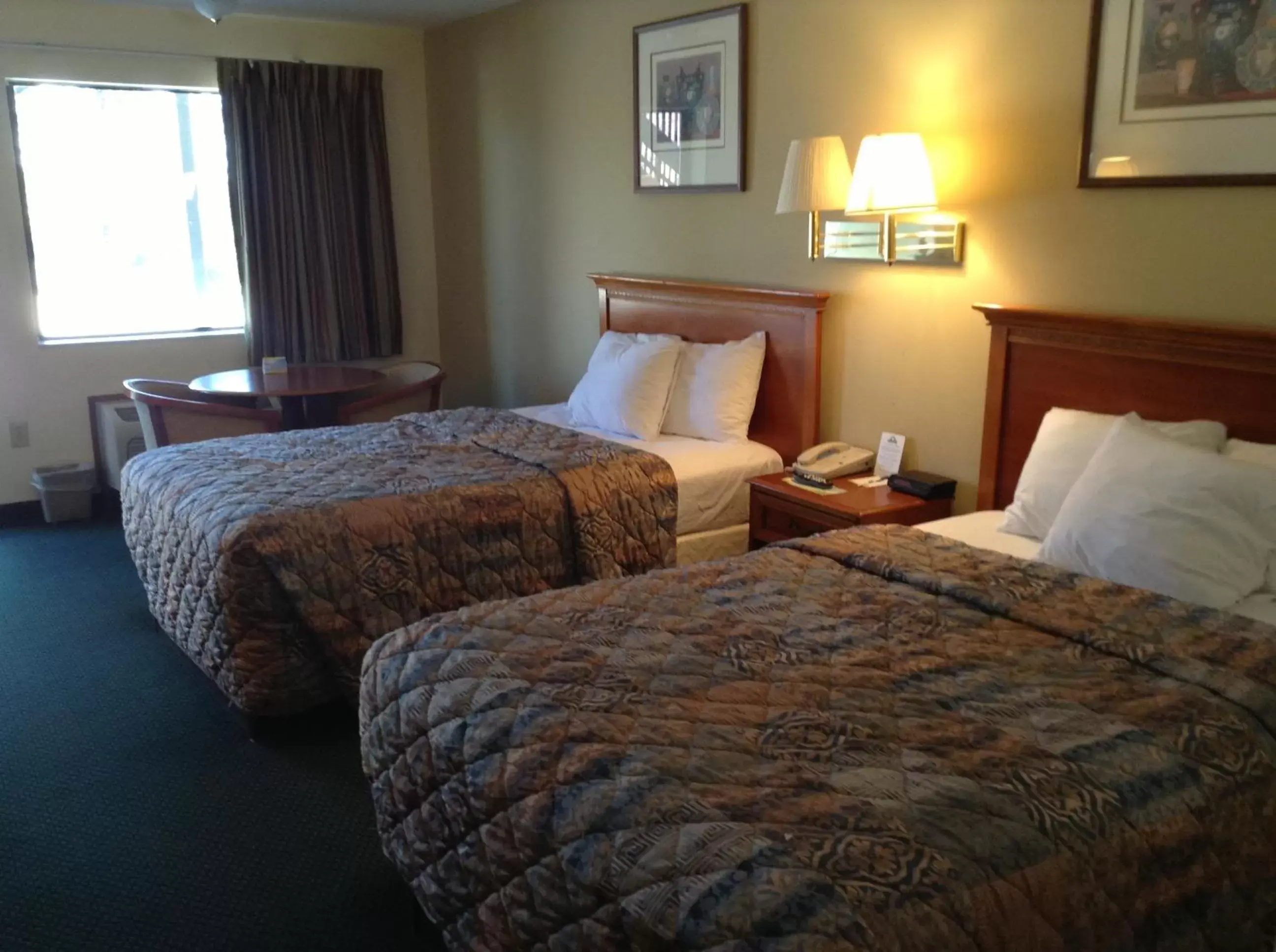 Queen Room with Two Queen Beds - Smoking in Days Inn & Suites by Wyndham Tucker/Northlake