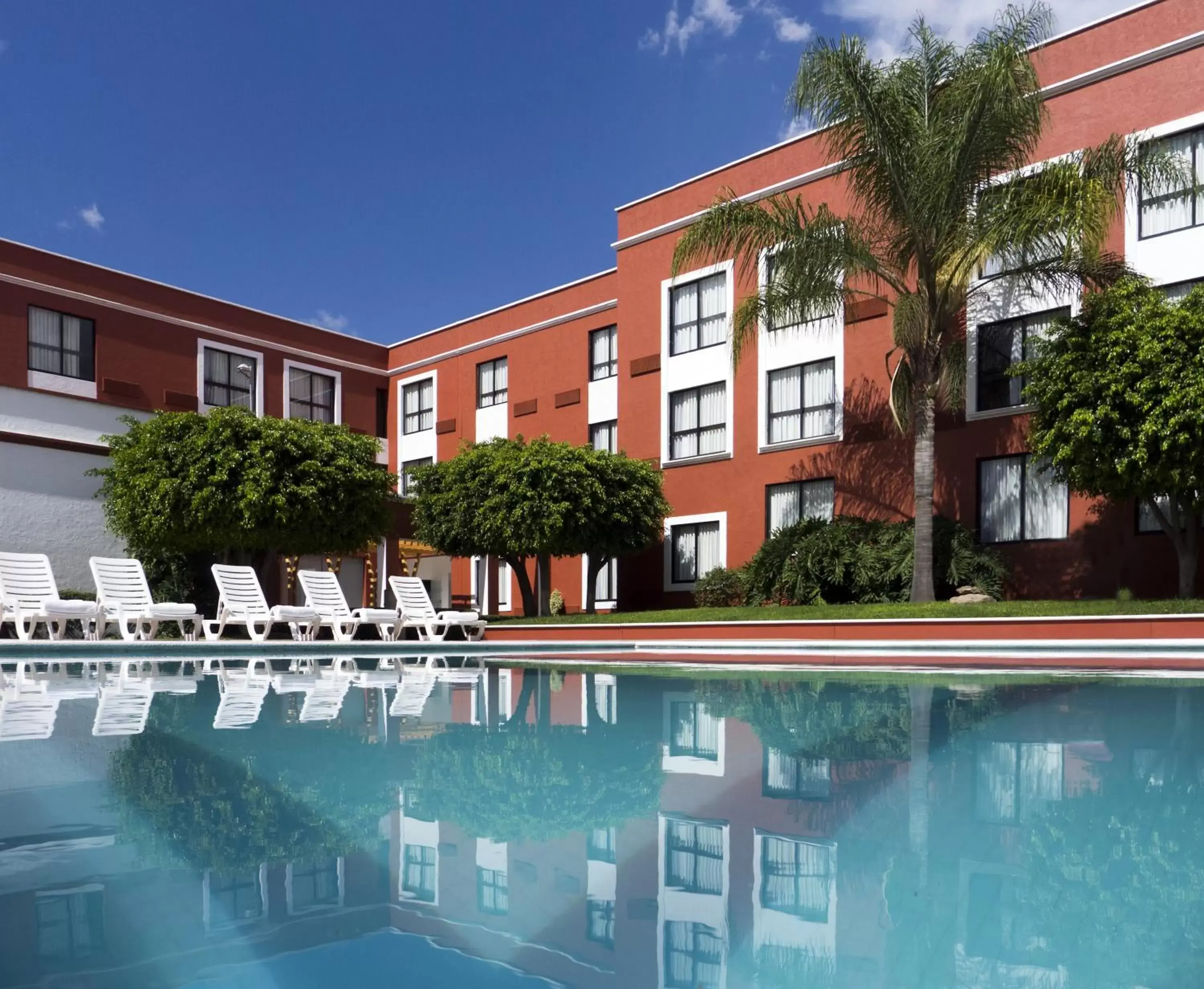 Swimming pool, Property Building in Fiesta Inn Leon