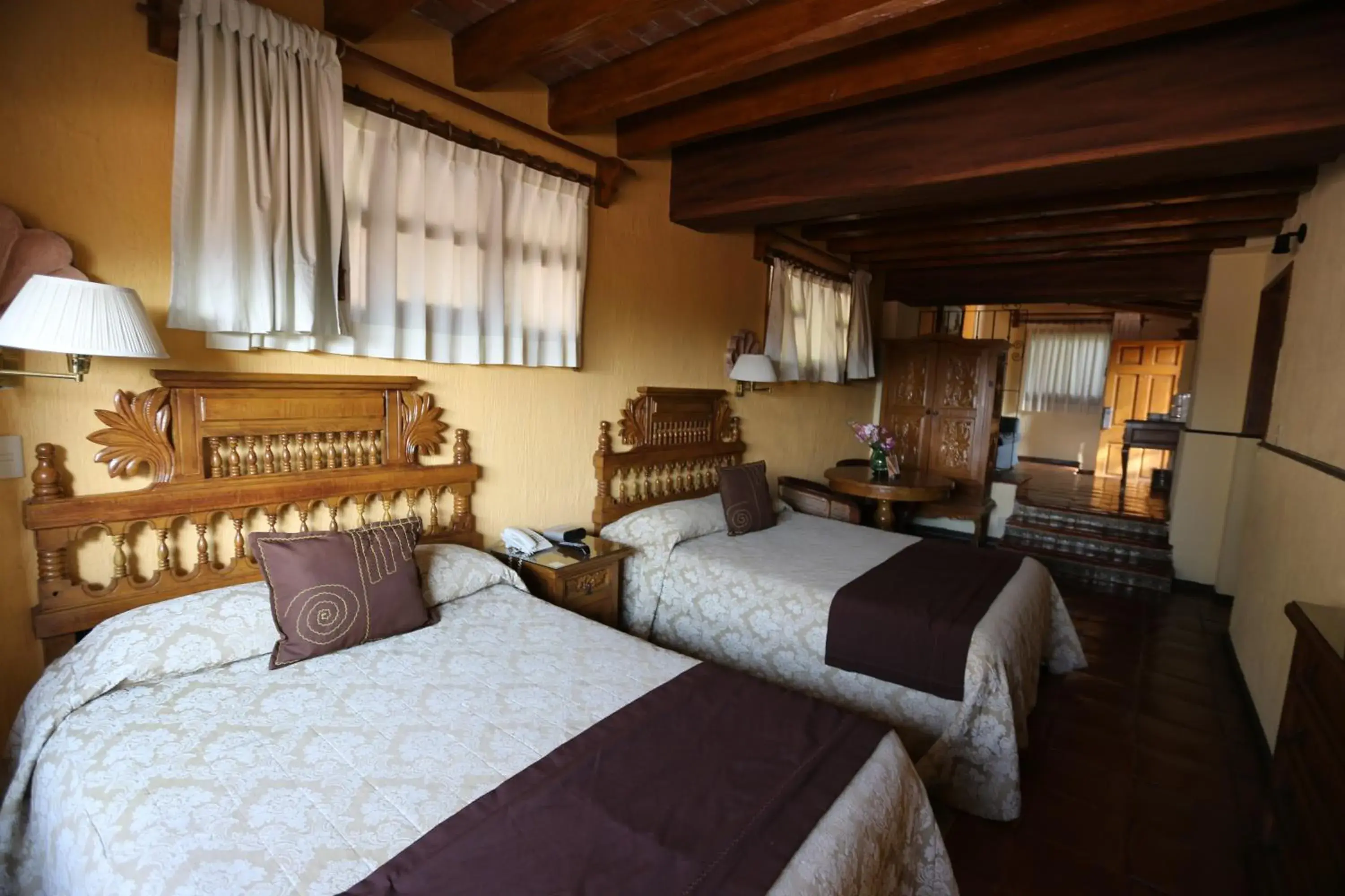 Bed in Villa San Jose Hotel & Suites
