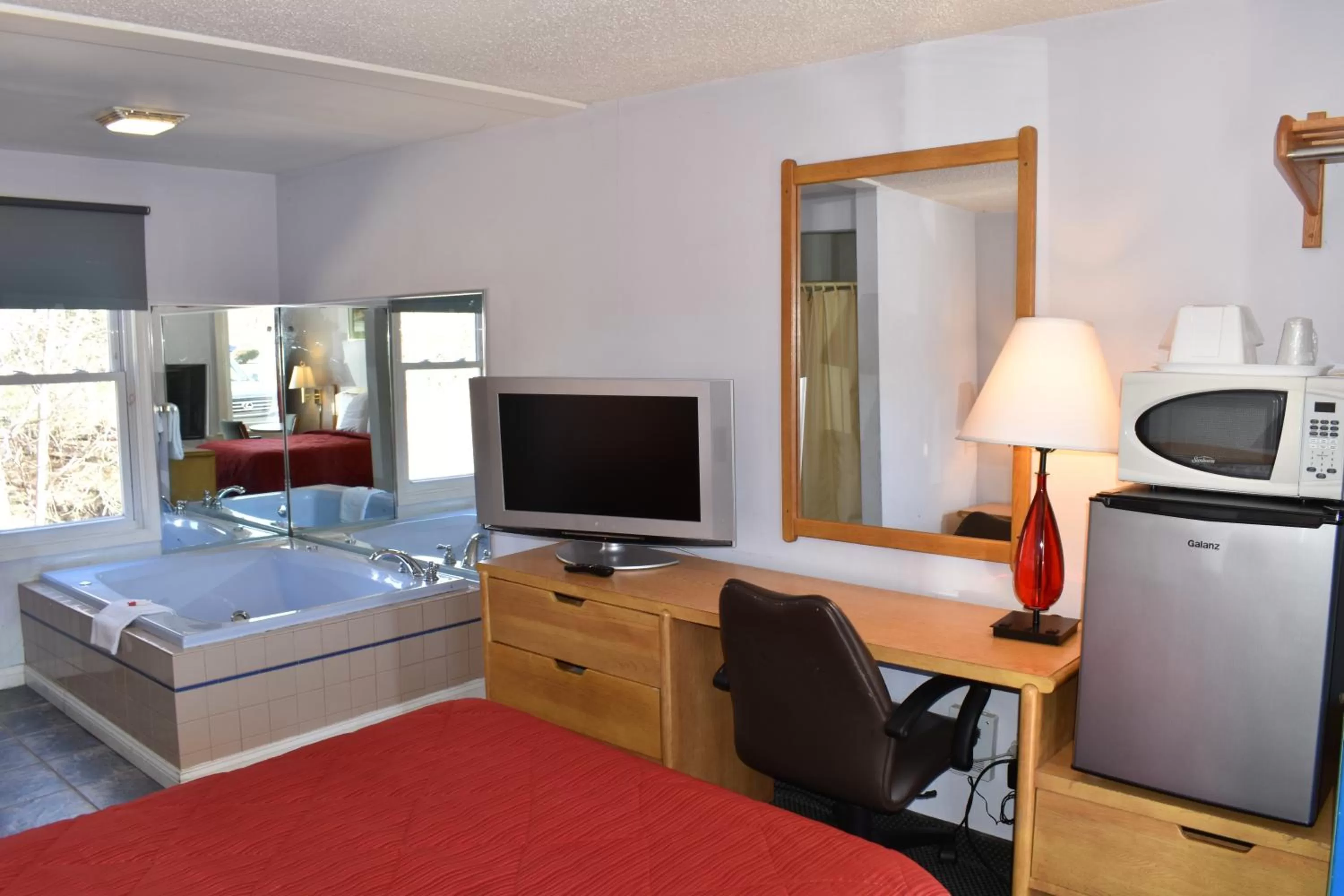 Bed in POCONO NIGHT LODGE