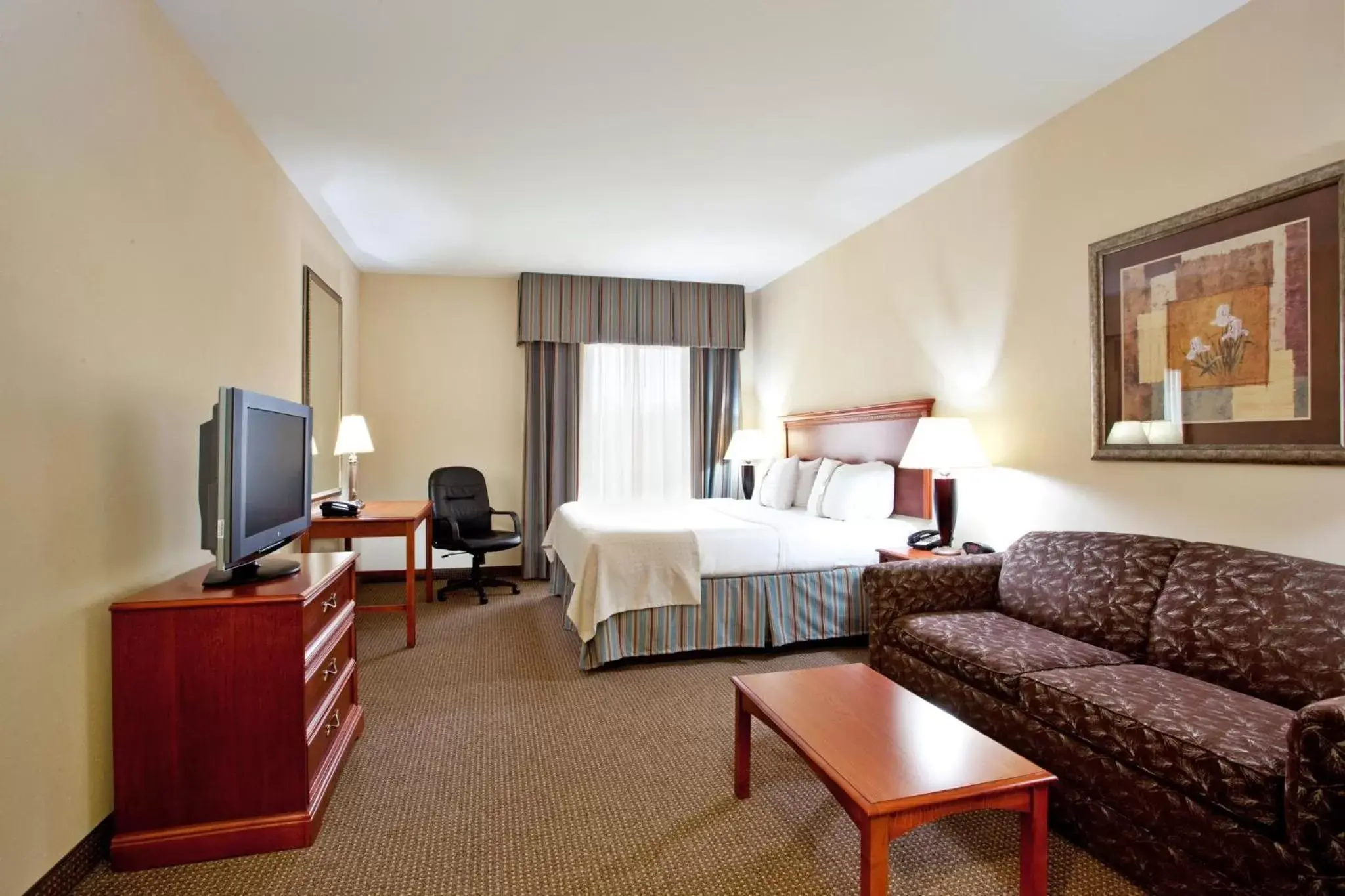 Photo of the whole room, TV/Entertainment Center in Holiday Inn Hotel & Suites Beckley, an IHG Hotel