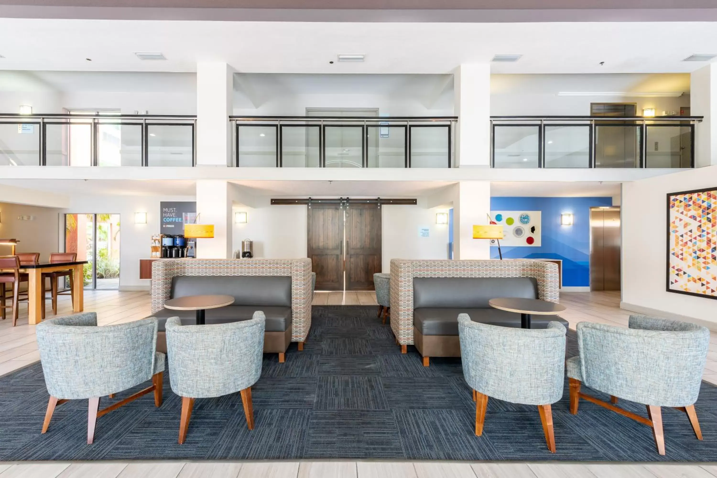 Lobby or reception, Lounge/Bar in Holiday Inn Express Hotel & Suites Bradenton West, an IHG Hotel