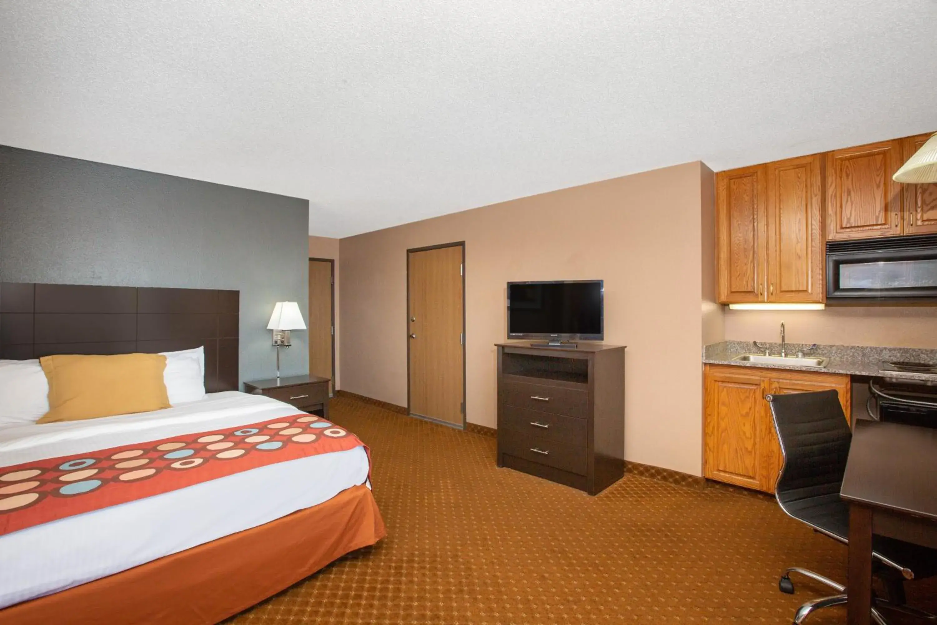 Photo of the whole room, TV/Entertainment Center in AmericInn by Wyndham Coralville