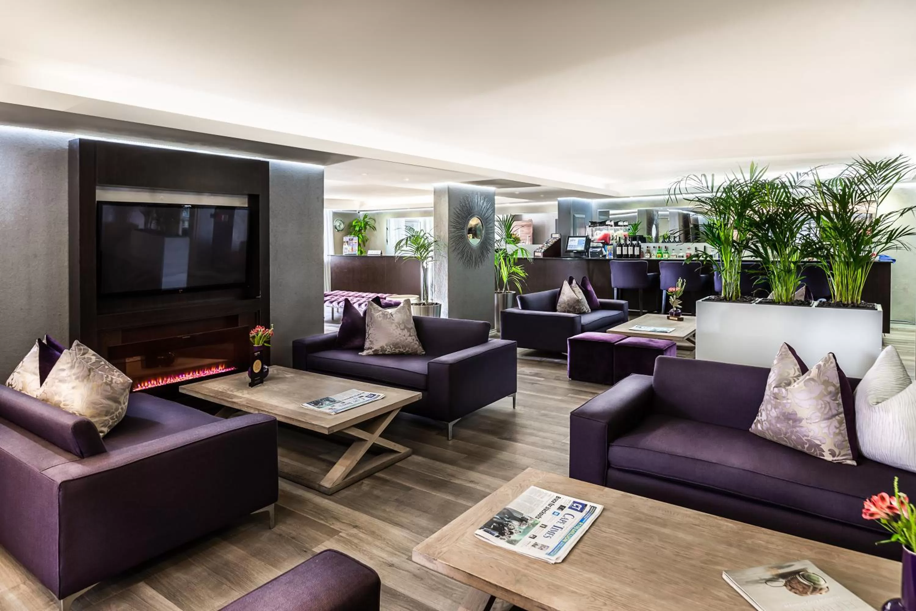 Communal lounge/ TV room in The Hyde All Suite Hotel