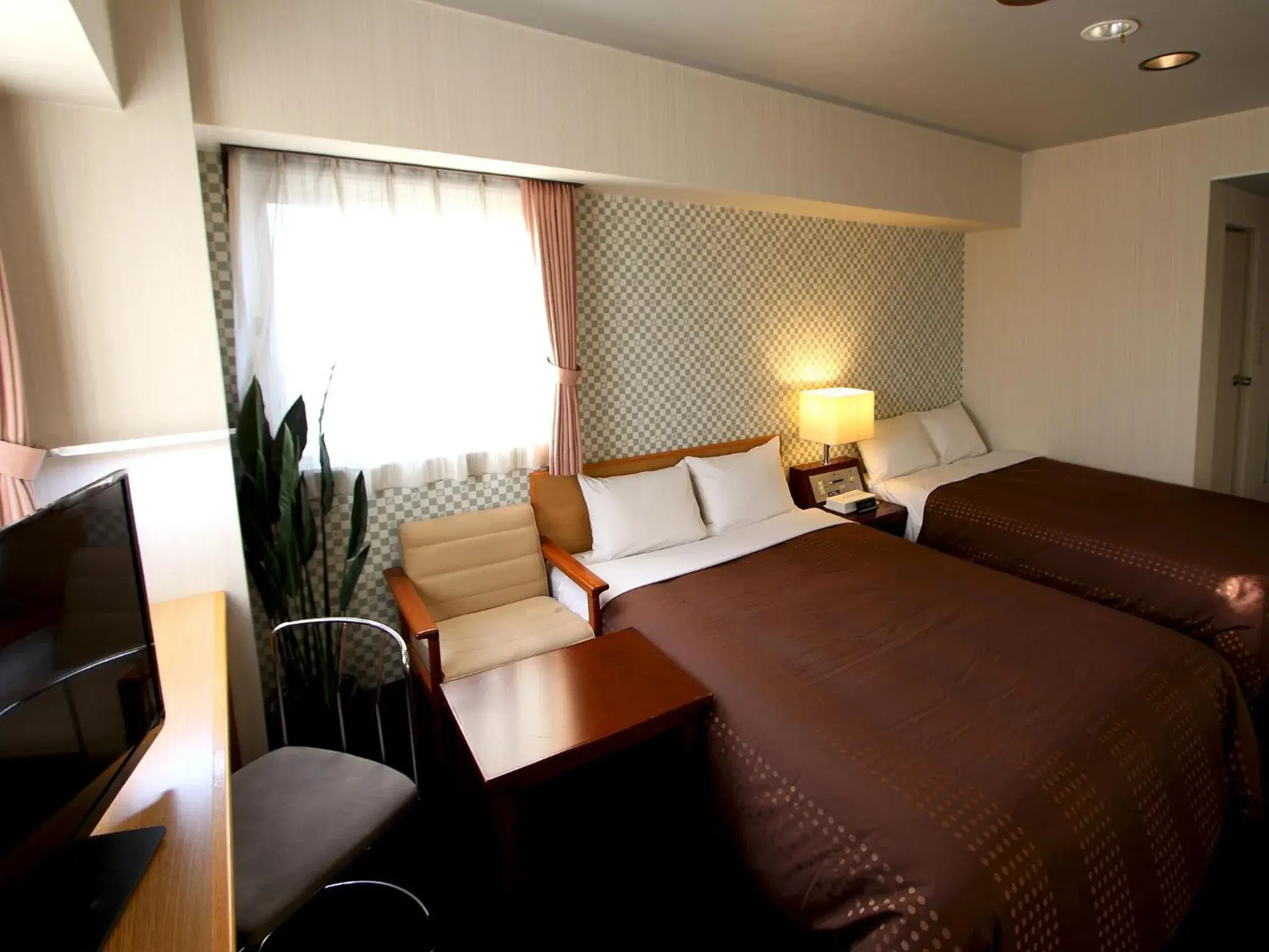 Bed in HOTEL LiVEMAX BUDGET Chitose