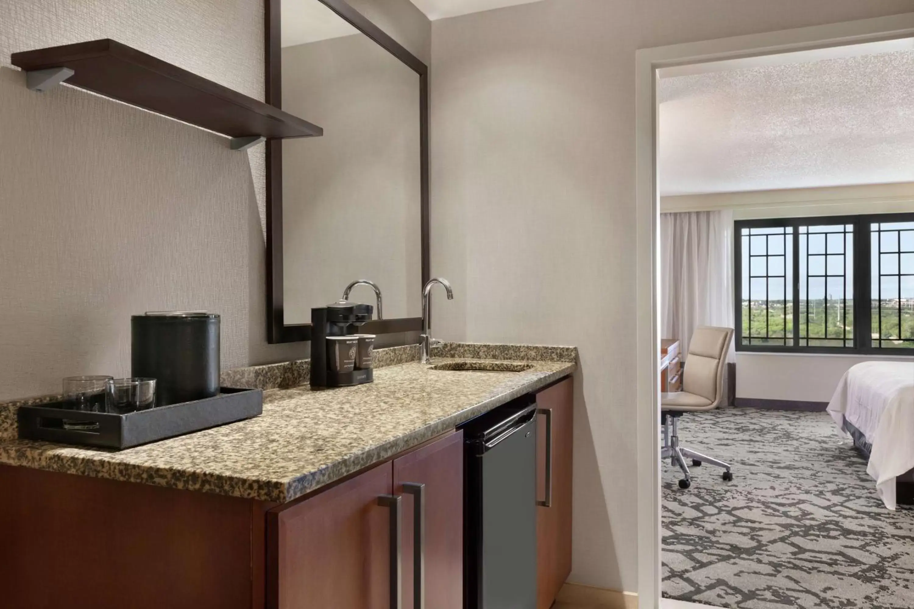 Bedroom, Kitchen/Kitchenette in Embassy Suites Dallas - DFW Airport North