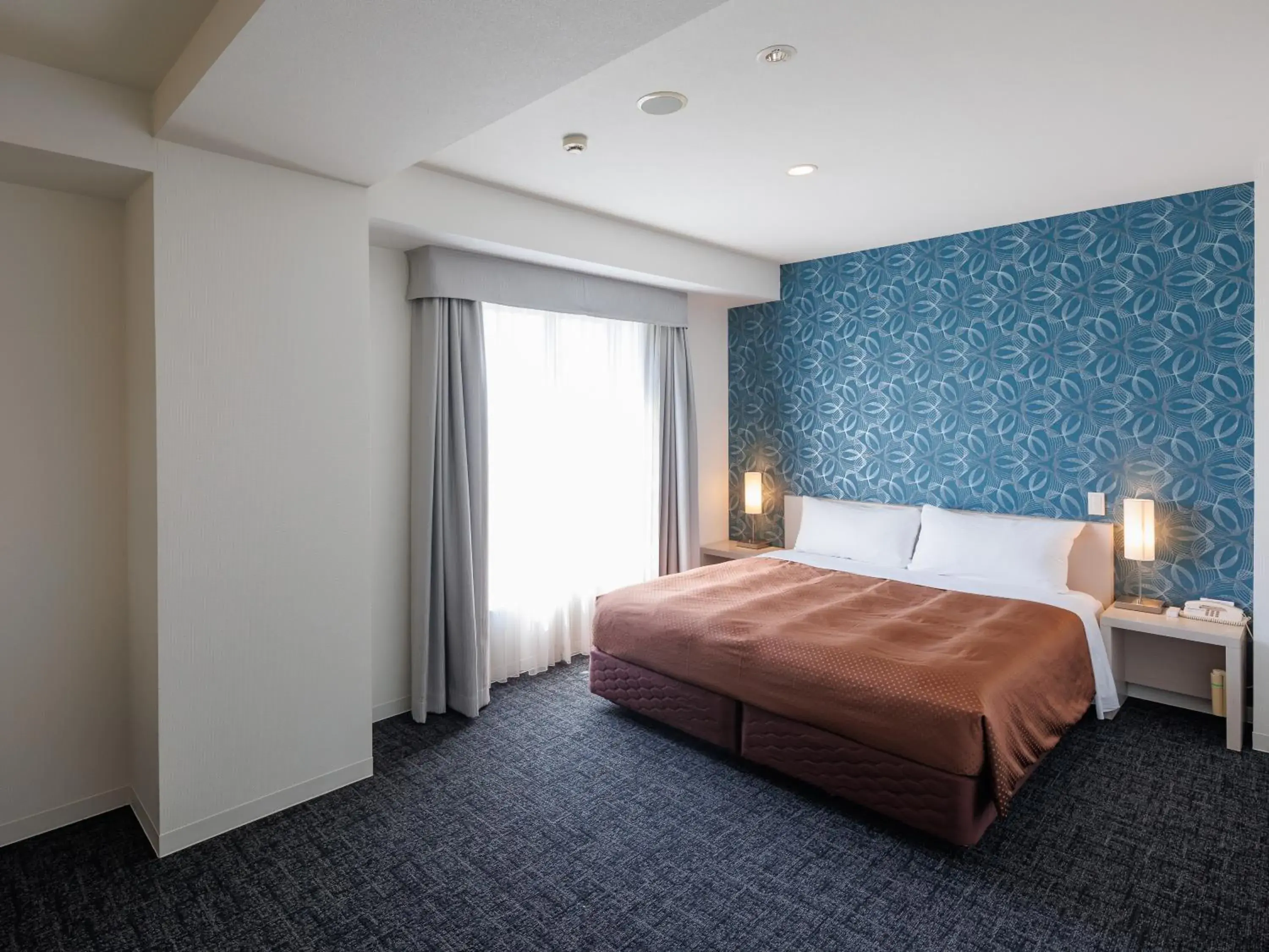 Bed in J Hotel Rinku Bed in J Hotel Rinku