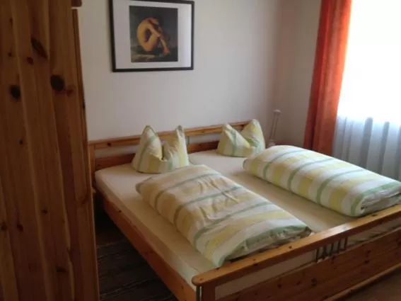 Bed in Gästehaus und Fewo Lamm Garni