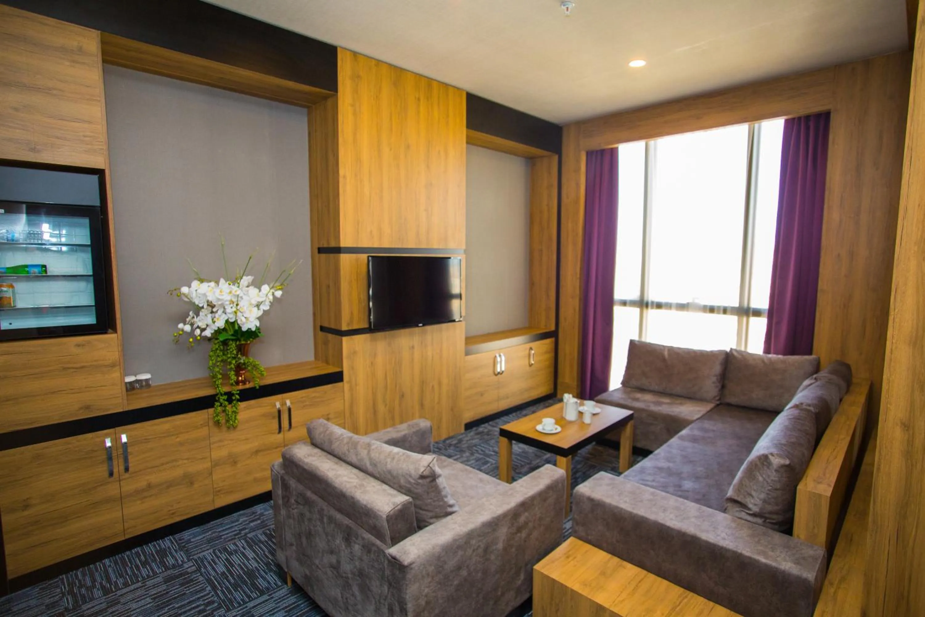 Seating area in SKY Business Hotel