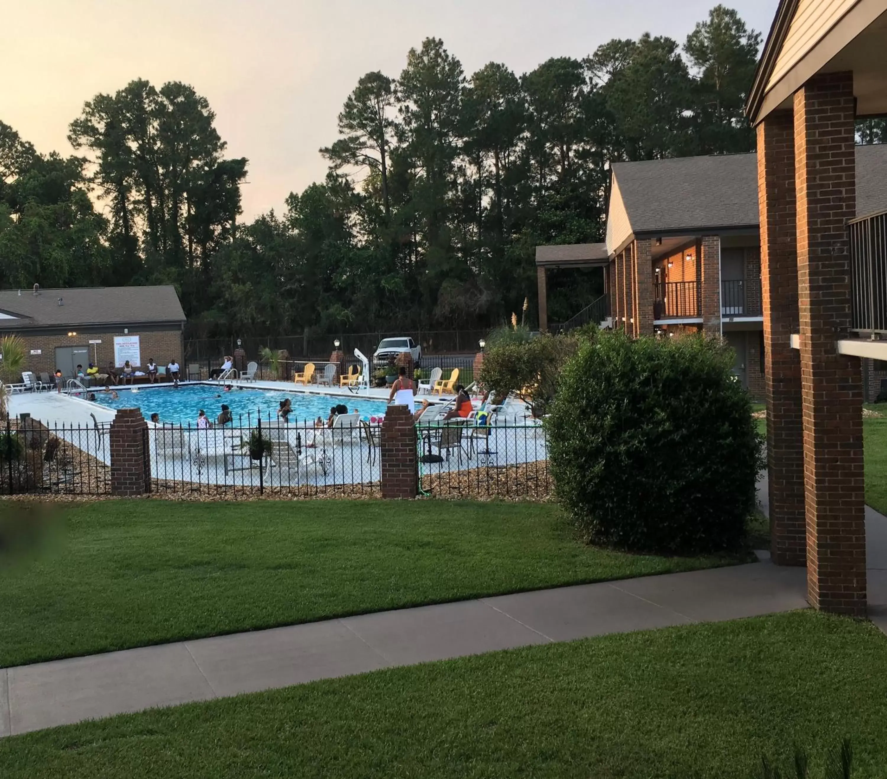 Swimming pool, Garden in At Home Inn & Suites