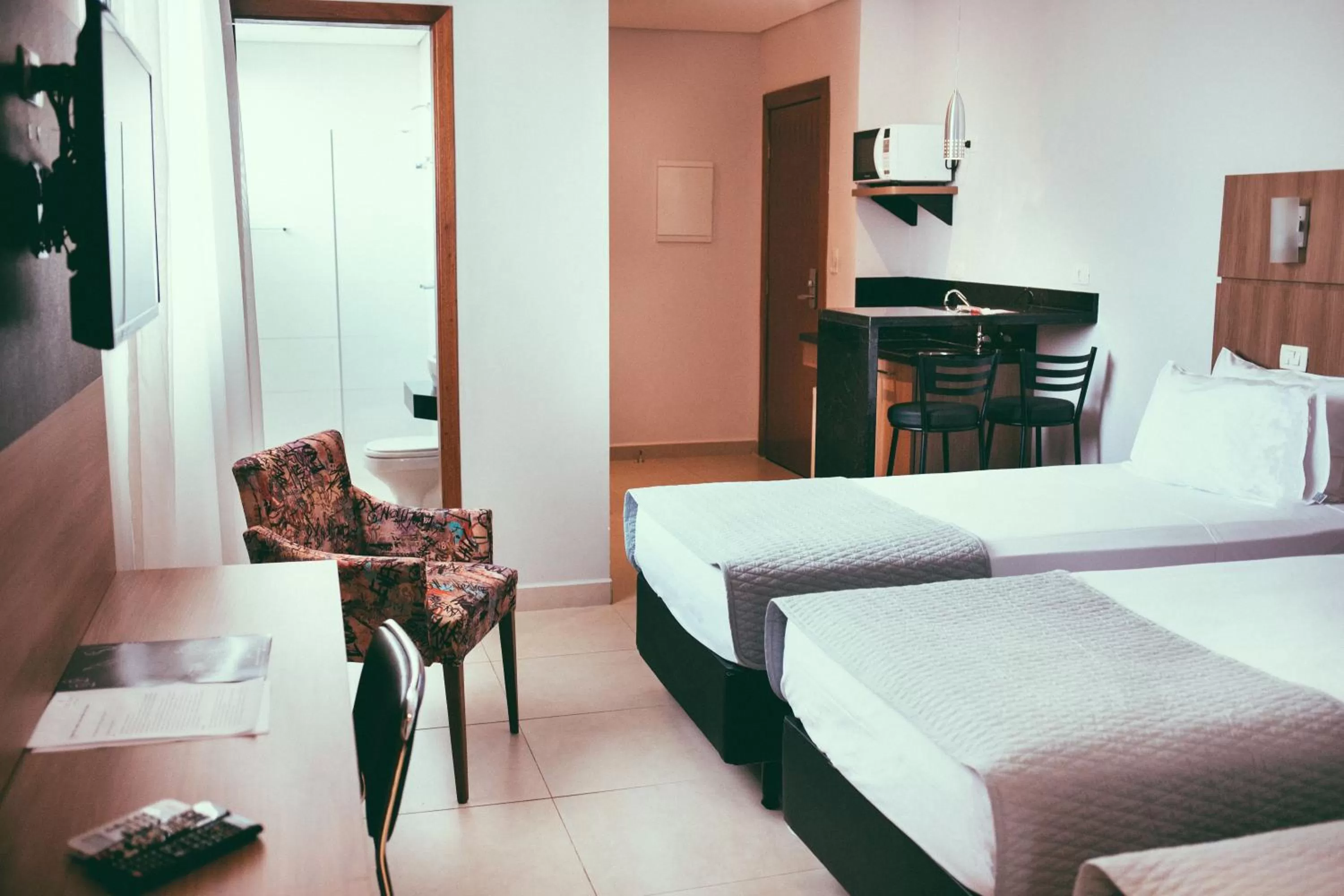 Communal lounge/ TV room, Bed in Occitano Apart Hotel