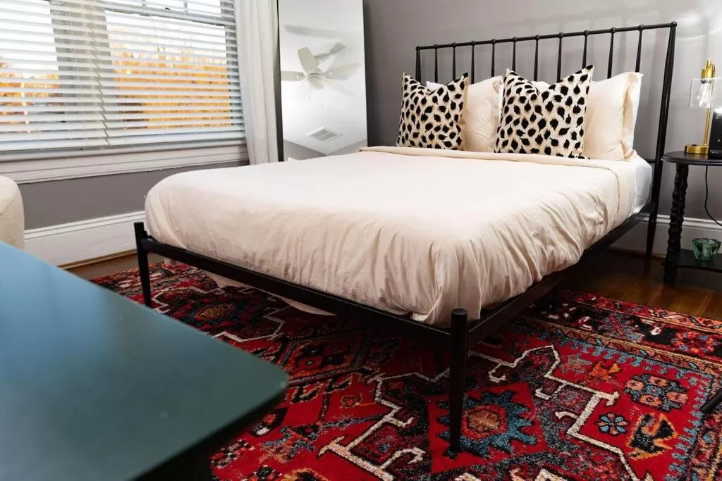 Bed in The Railway Suite - The Historic Winona House