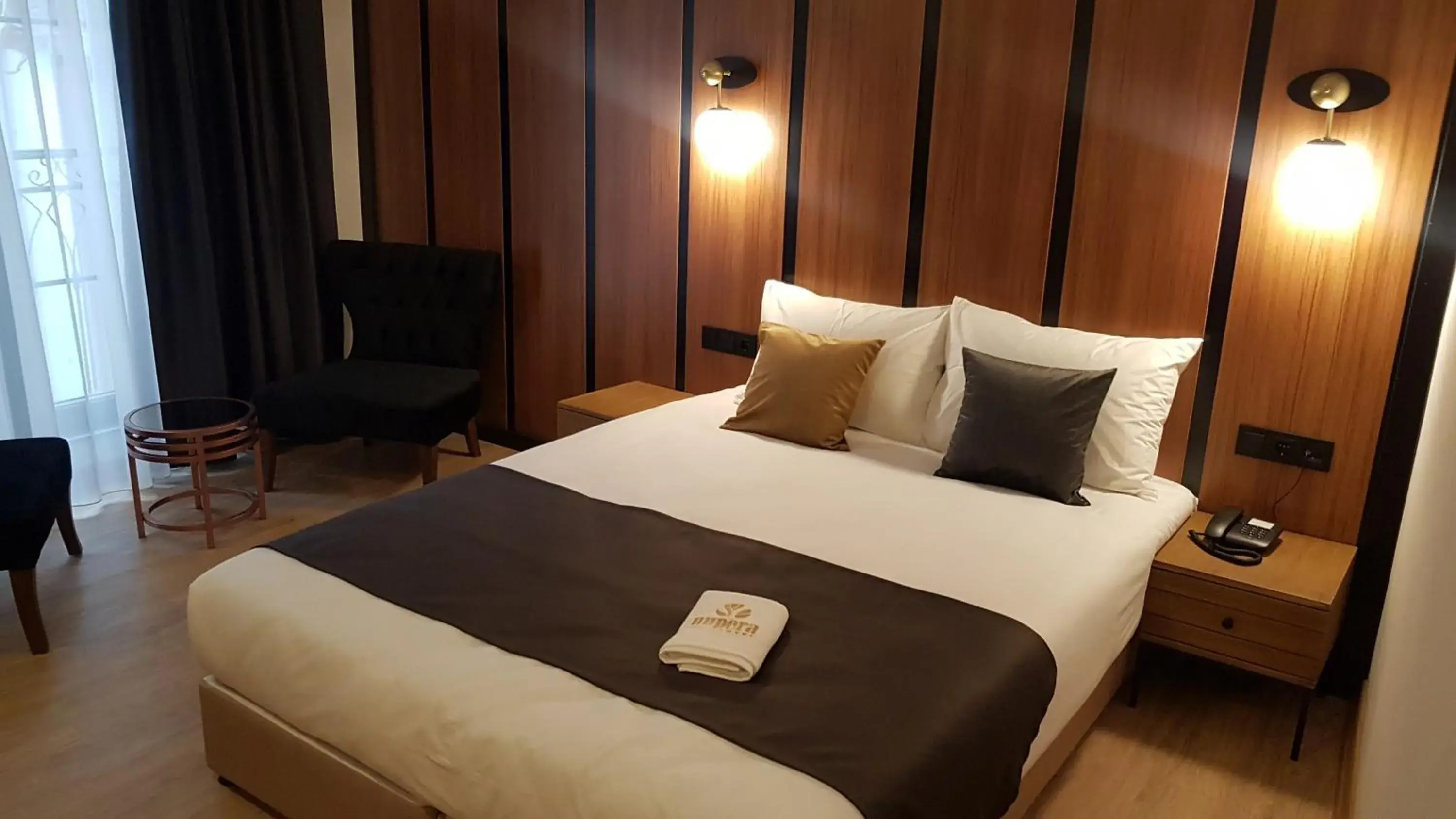Bed in NUPERA HOTEL