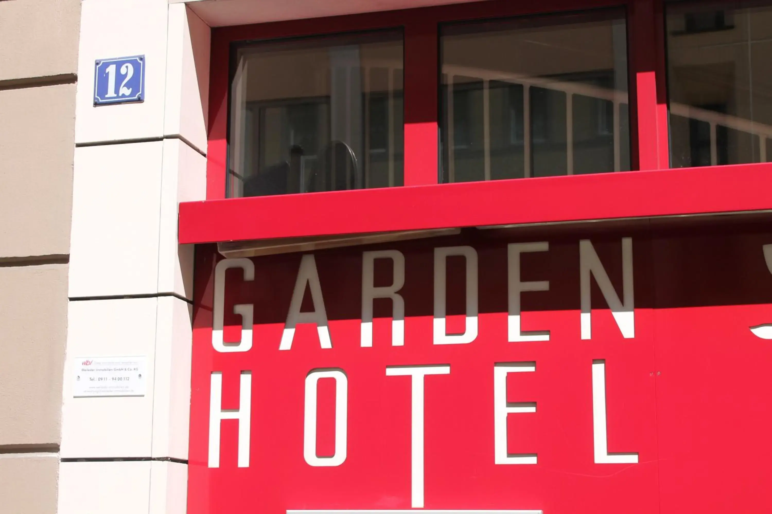 Facade/entrance, Property Logo/Sign in Garden Hotel