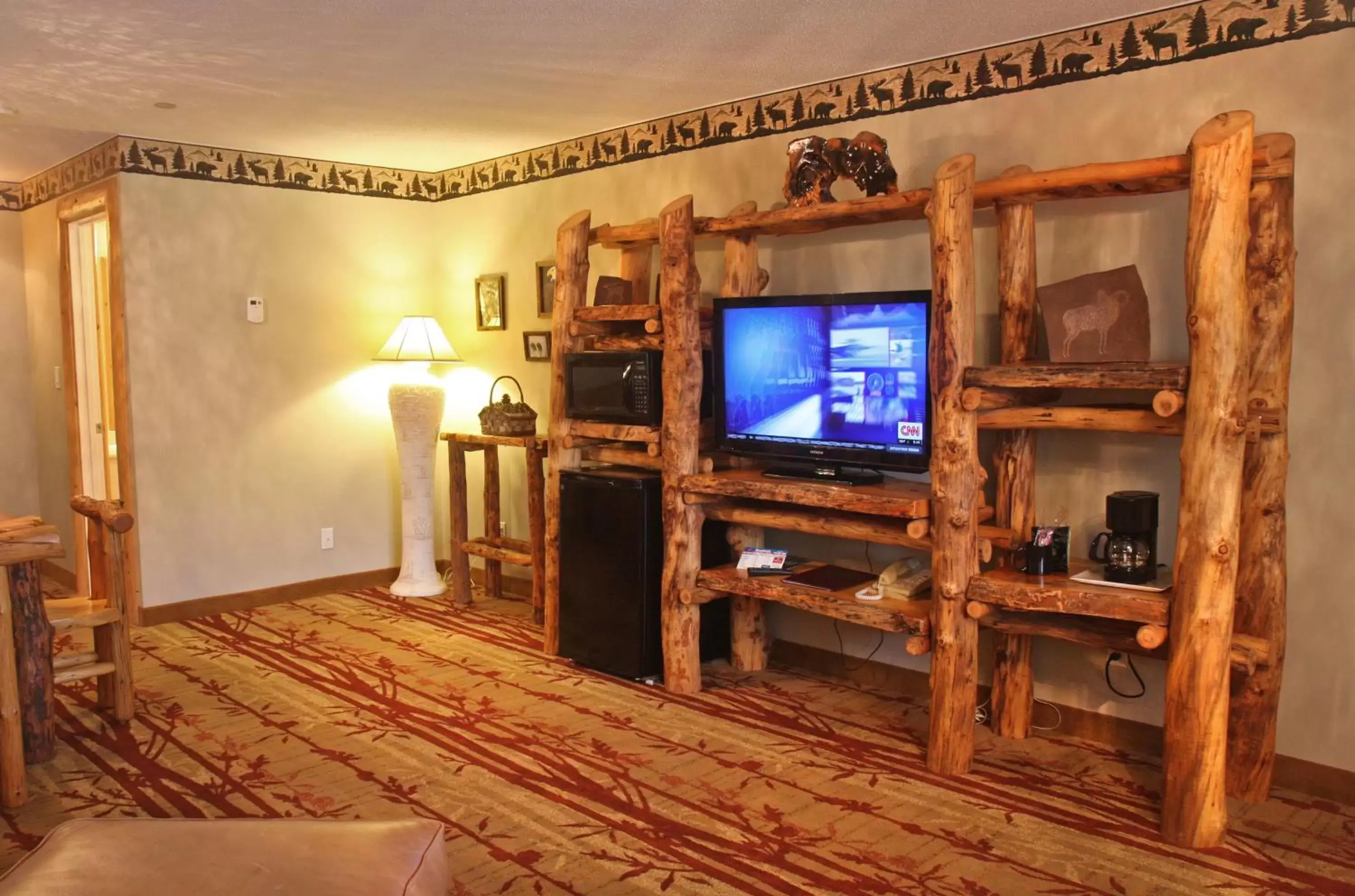 Photo of the whole room, TV/Entertainment Center in Gateway Inn and Suites