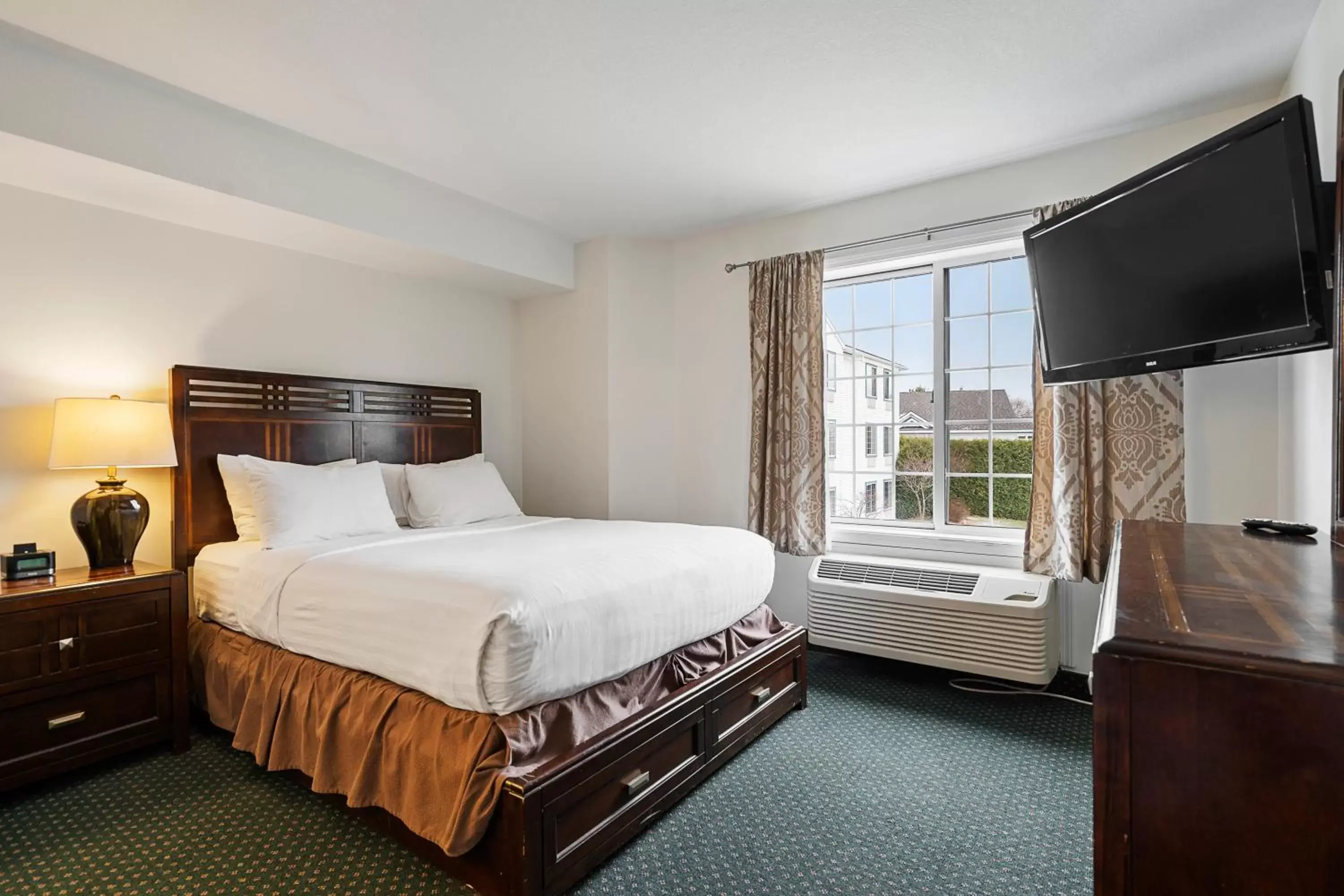 Bed in Charlevoix Inn & Suites SureStay Collection by Best Western