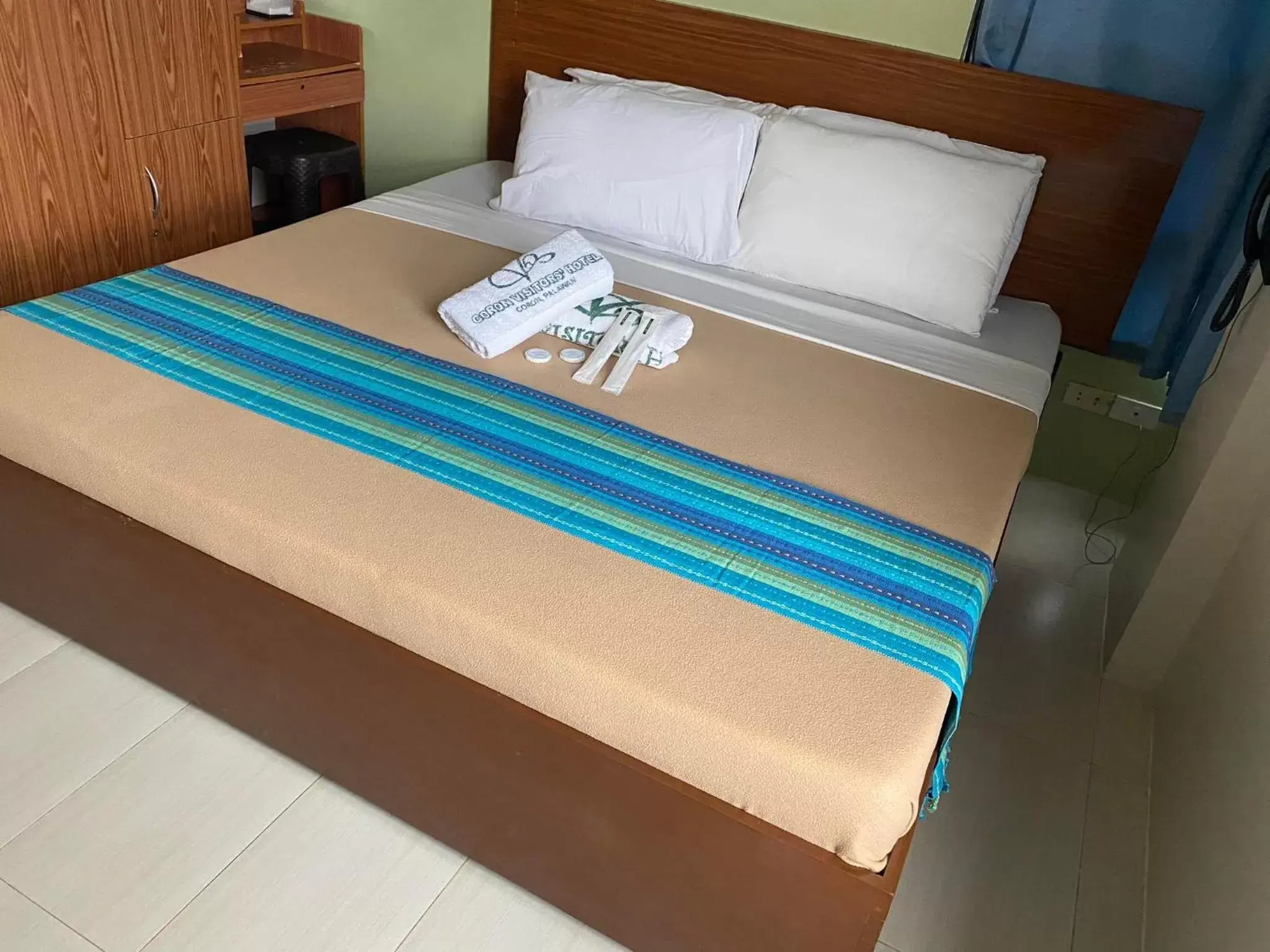 Bed in Coron Visitors Hotel