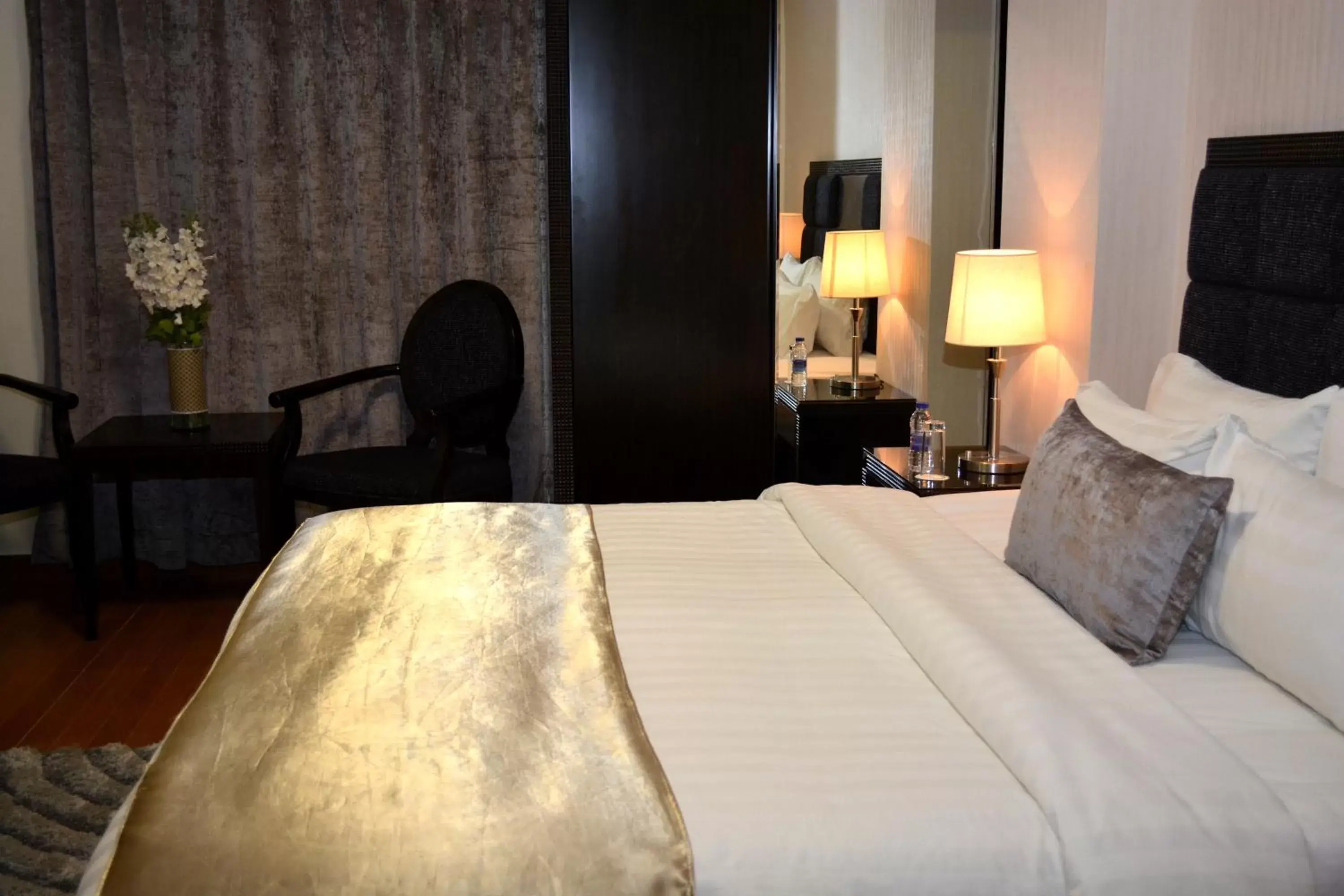 Bed in Tilal Almadina Hotel & Suites