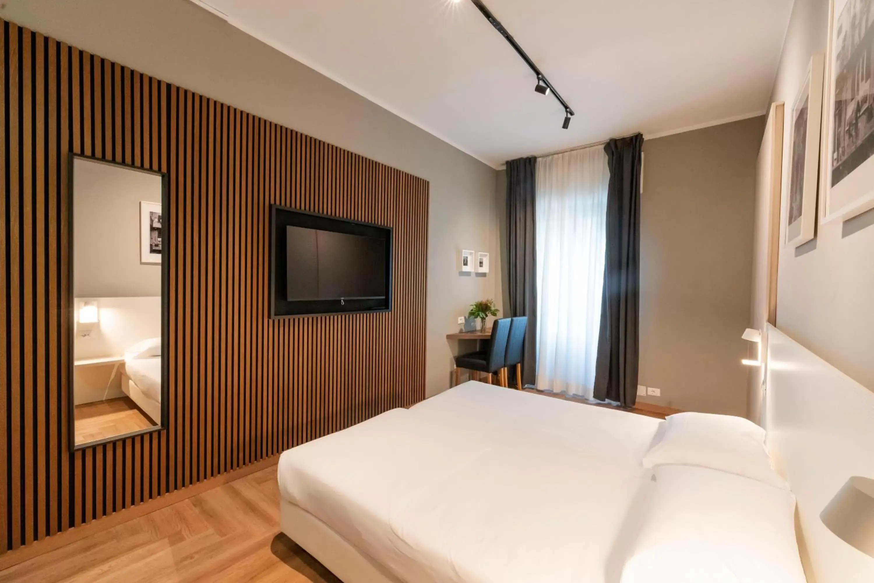 Bed in Kleos Hotel Milano