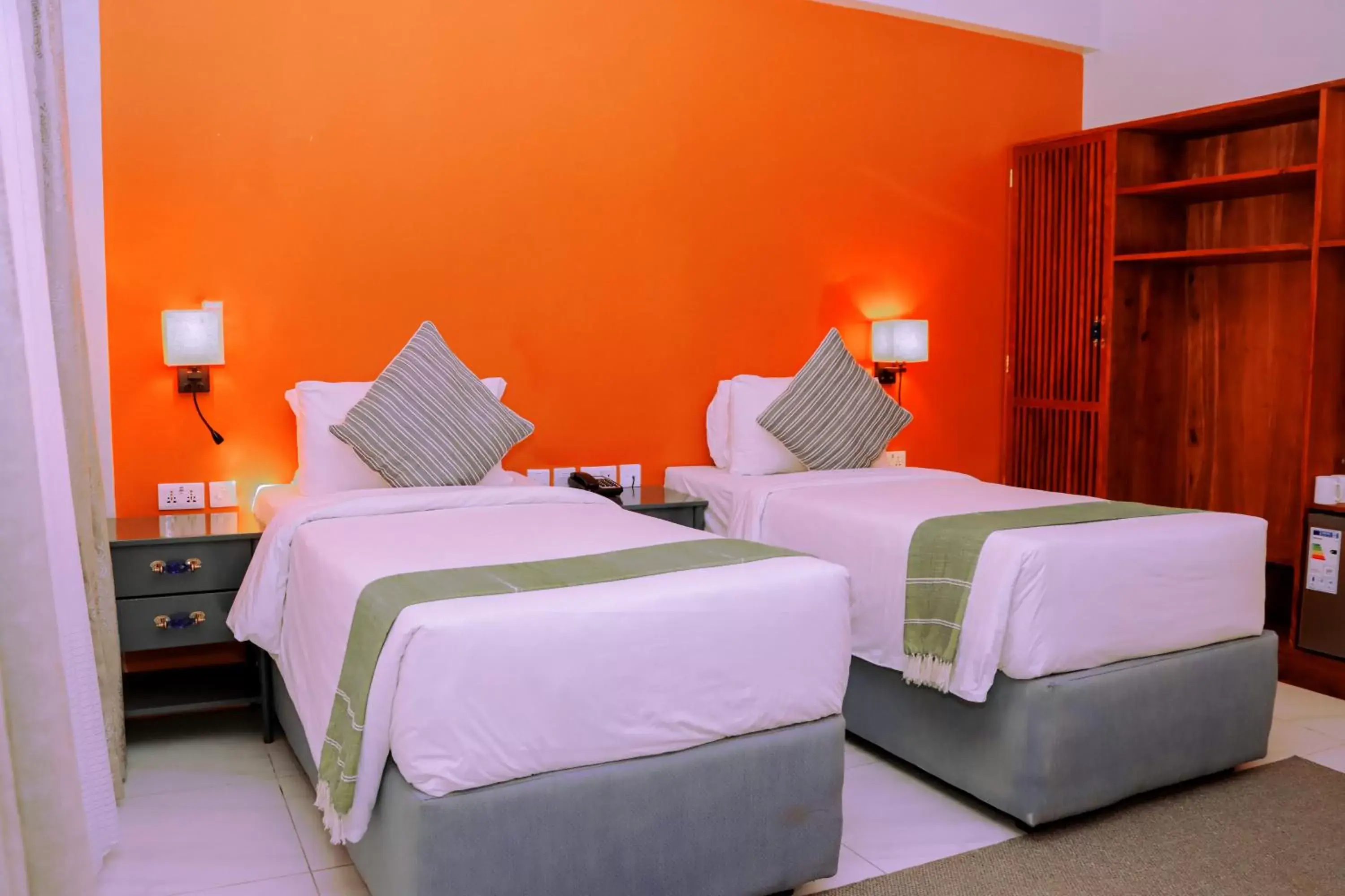 Bed in Jangwani Sea Breeze Resort