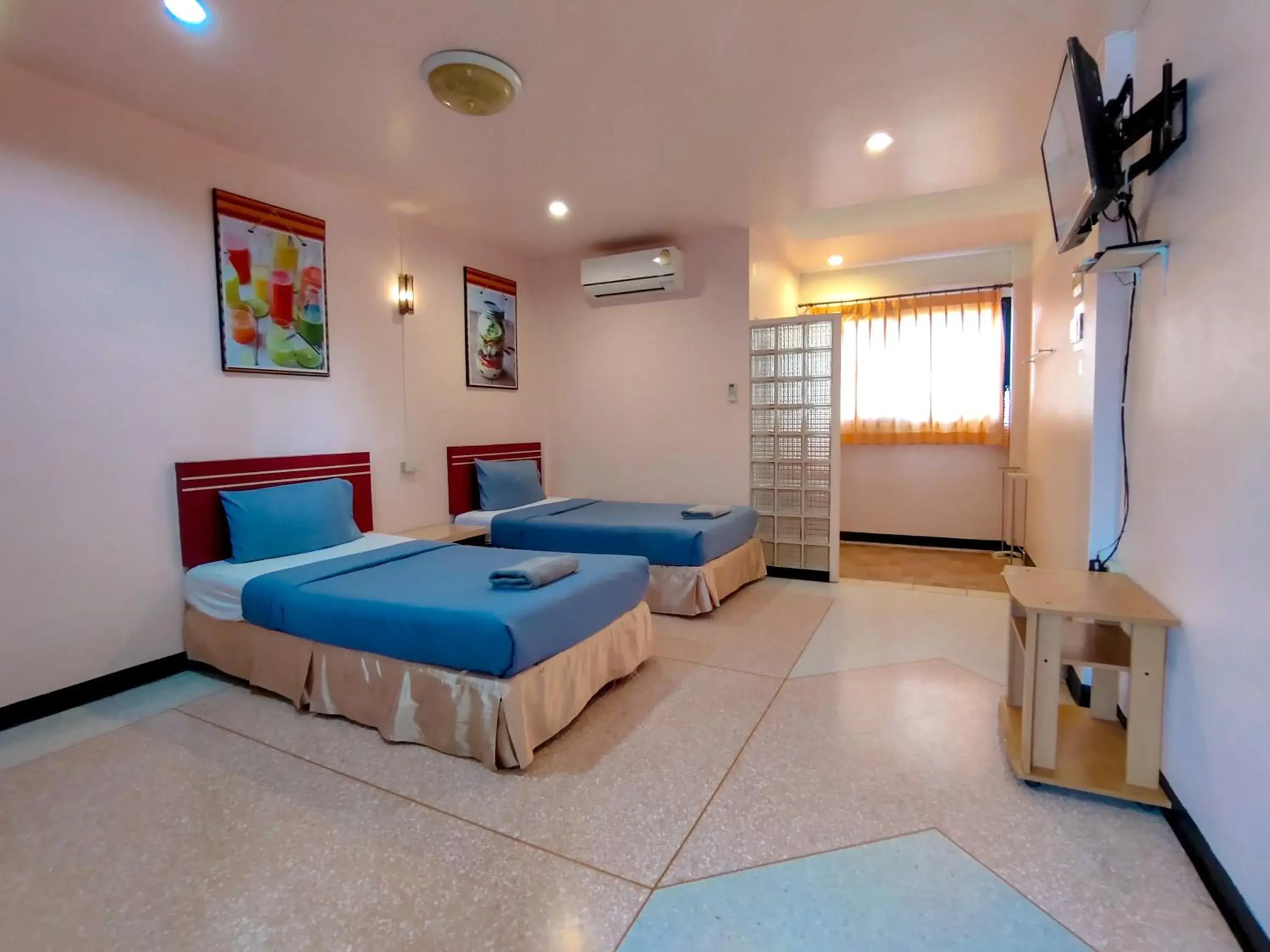 Bed in Srisomthai Hotel