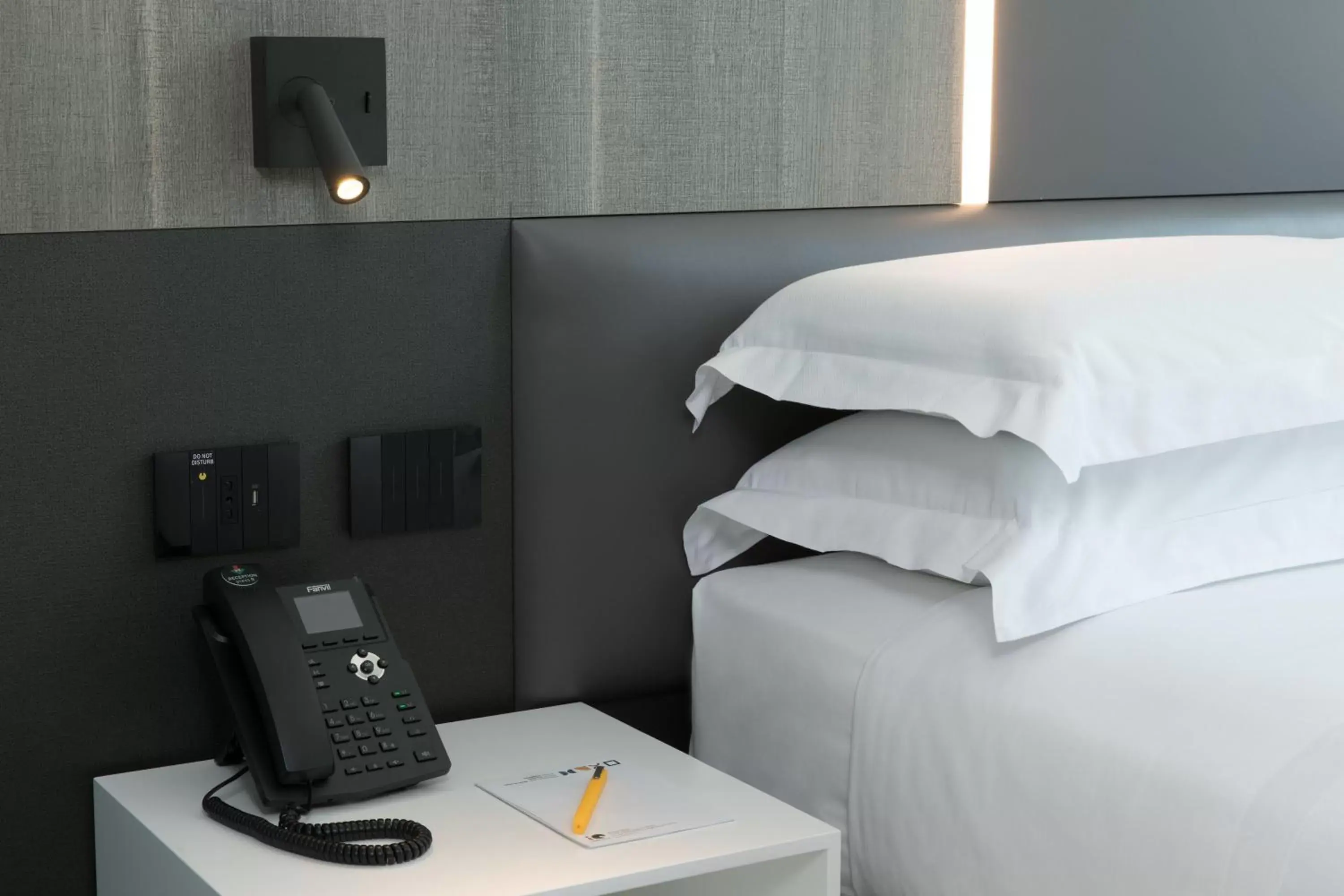 Bed in iQ Hotel Milano