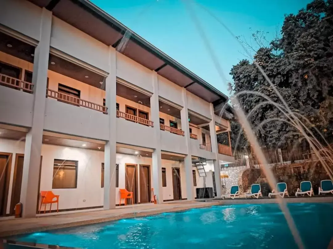 Swimming pool, Property Building in Charms Hotel